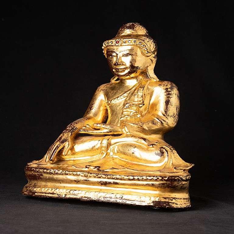 Material: bronze
39,5 cm high 
28,5 cm wide and 18,6 cm deep
Weight: 8.2 kgs
Gilded with 24 krt. gold
Mandalay style
Bhumisparsha mudra
Originating from Burma
19th century
With inlayed eyes.
 