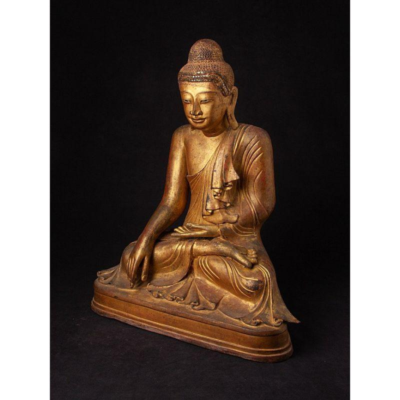 Material: bronze
52,5 cm high 
42,6 cm wide and 23,5 cm deep
Weight: 20.4 kgs
Gilded with 24 krt. gold
Mandalay style
Bhumisparsha mudra
Originating from Burma
19th century
One of the best bronze Mandalay Buddhas, ever in my collection