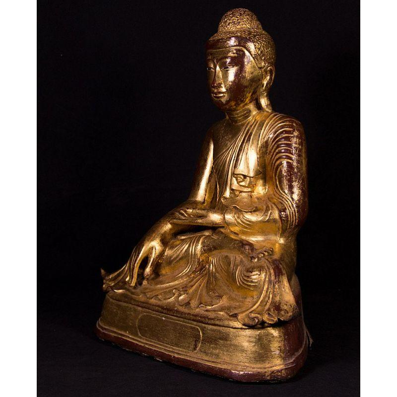 Material: bronze.
Measures: 47 cm high. 
38 cm wide and 25 cm deep.
Weight: 26.25 kgs.
Gilded with 24 krt. gold.
Mandalay style.
Bhumisparsha mudra.
Originating from Burma.
19th Century.

