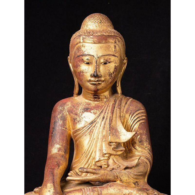 This antique bronze Buddha statue is a truly unique and special collectible piece. Standing at 45 cm high, 40 cm wide, and 24.5 cm deep, it is made of bronze and it has been gilded with 24 krt gold leaf, adding to its beauty and value. The intricate