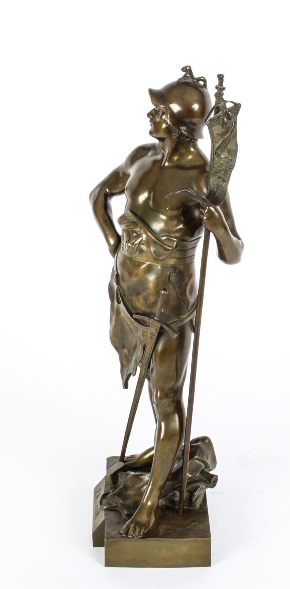 This is a large French bronze sculpture of a mythological warrior entitled 'Patria' inscribed and signed on the base Emile Louis Picault, Circa 1870 in date.
 
The figure has a light brown patina and is armed with a large sword, wearing a helmet