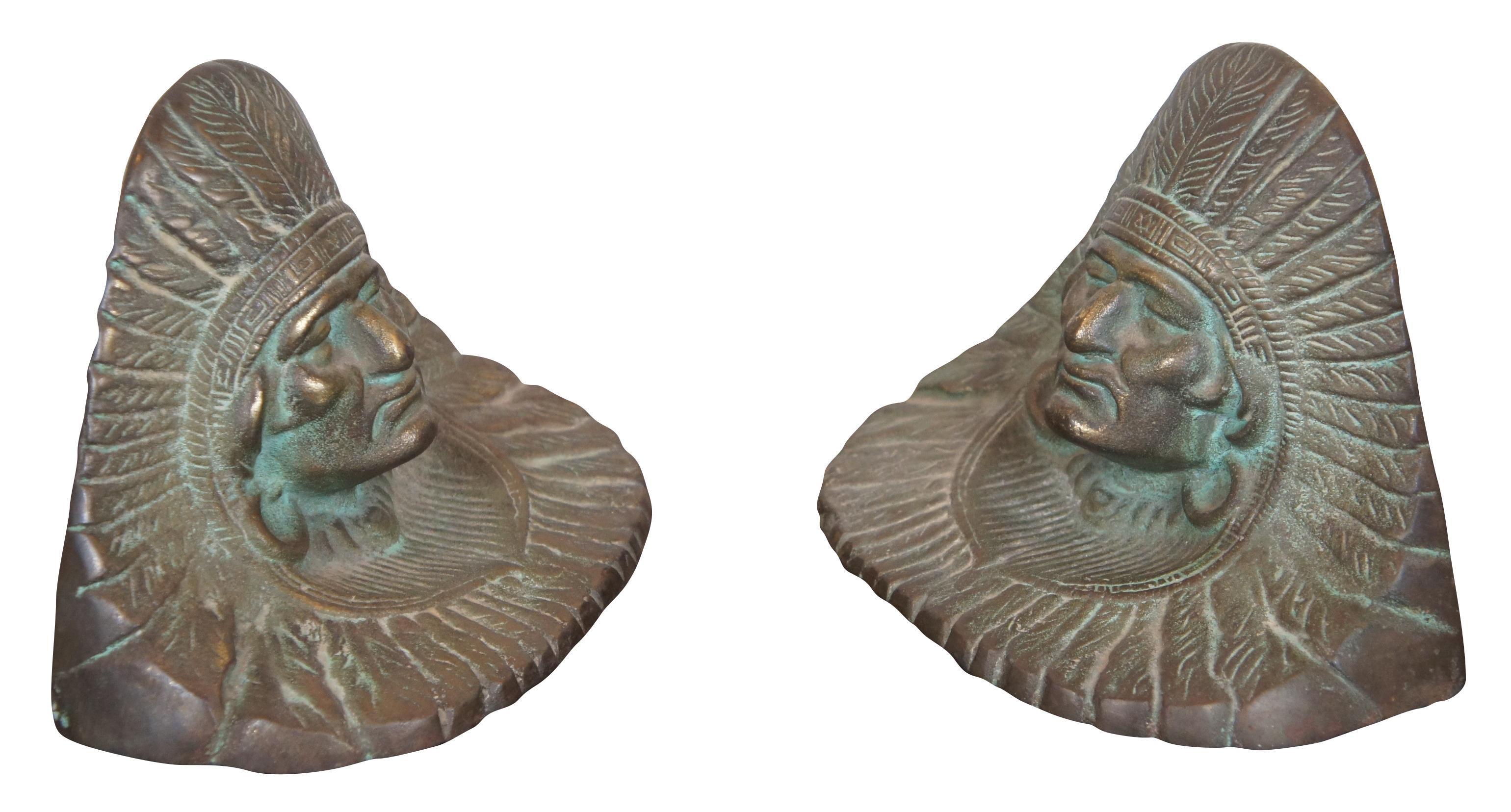 Antique bronze bookends featuring the Bust of a Native American Indian Chief adorned with headdress. Attributed to VR Sturtevant.