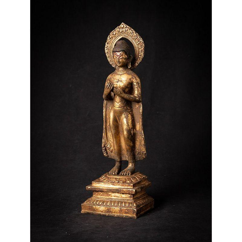Material: bronze
Measures: 41,5 cm high 
14 cm wide and 9,7 cm deep
Weight: 3.639 kgs
Fire gilded with 24 krt. gold
Originating from Nepal
Late 19th century
High quality !

