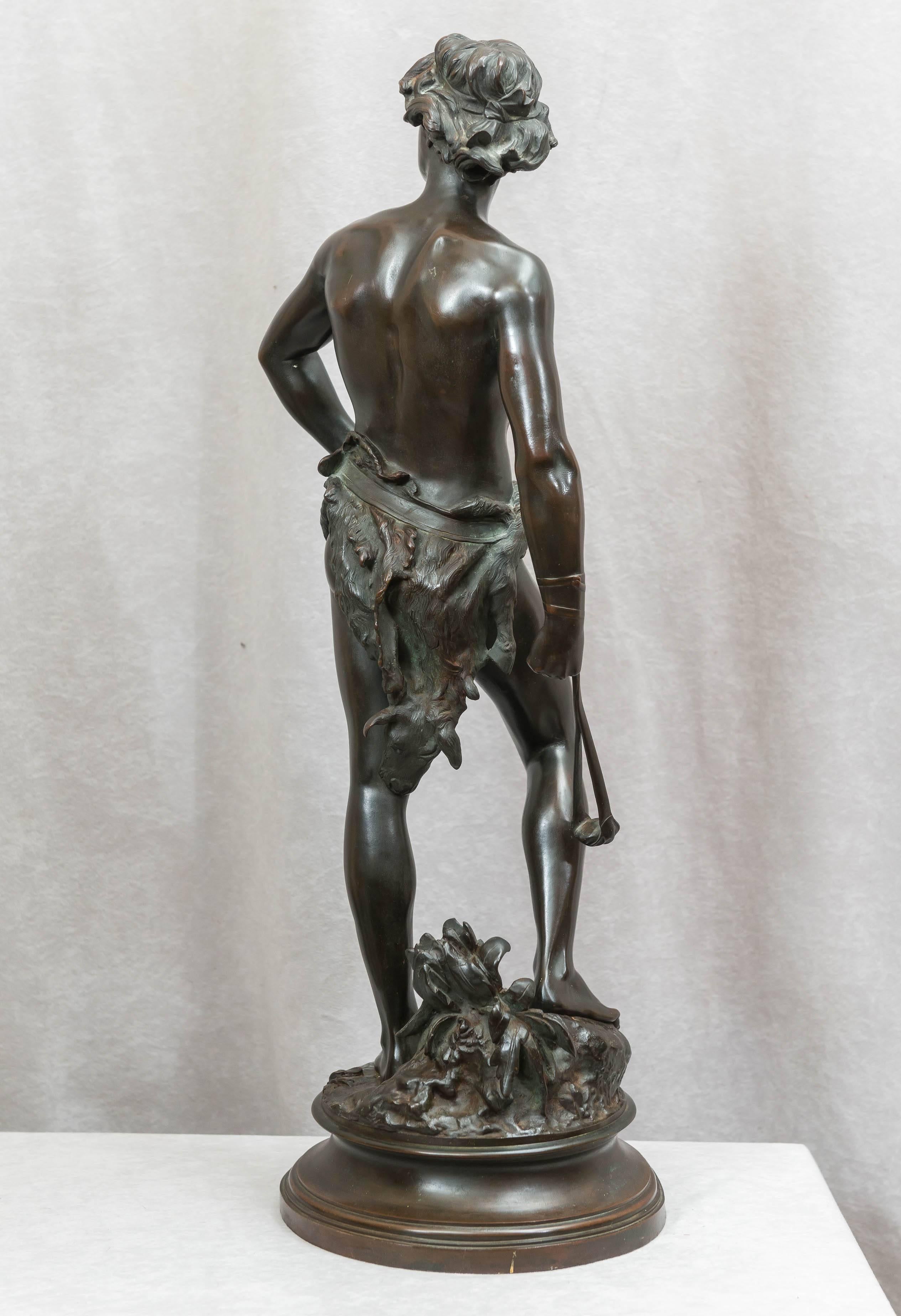 Patinated Antique Bronze of David Holding His Slingshot Ready for Action