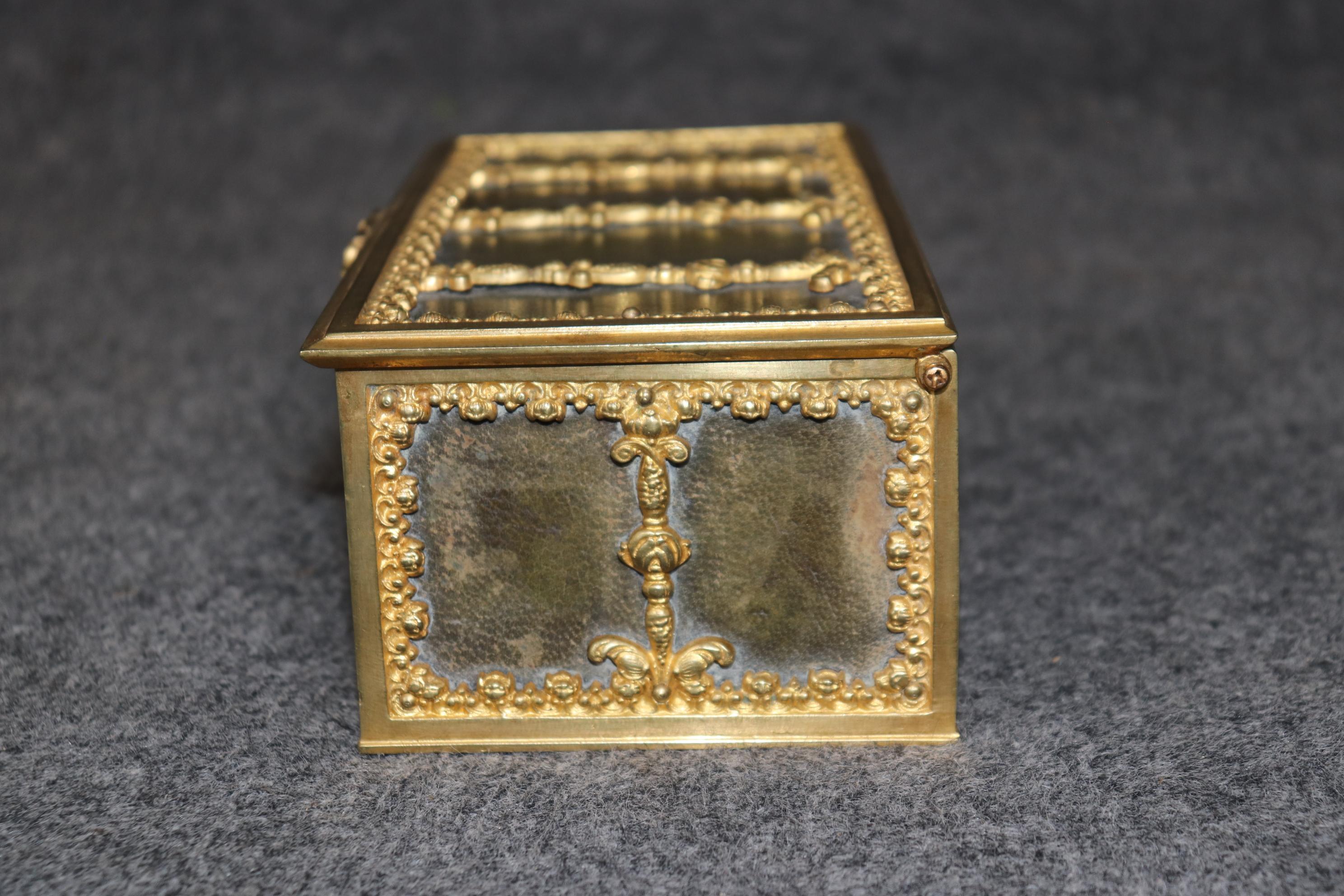 Dimensions - H: 3 3/4in W: 9 3/4in D: 5in 

This Antique Turn of the Century Bronze Ormolu and Leather Jewelry Casket is truly remarkable and is made of the highest quality! If you take a look at the photos provided you will see the attention to