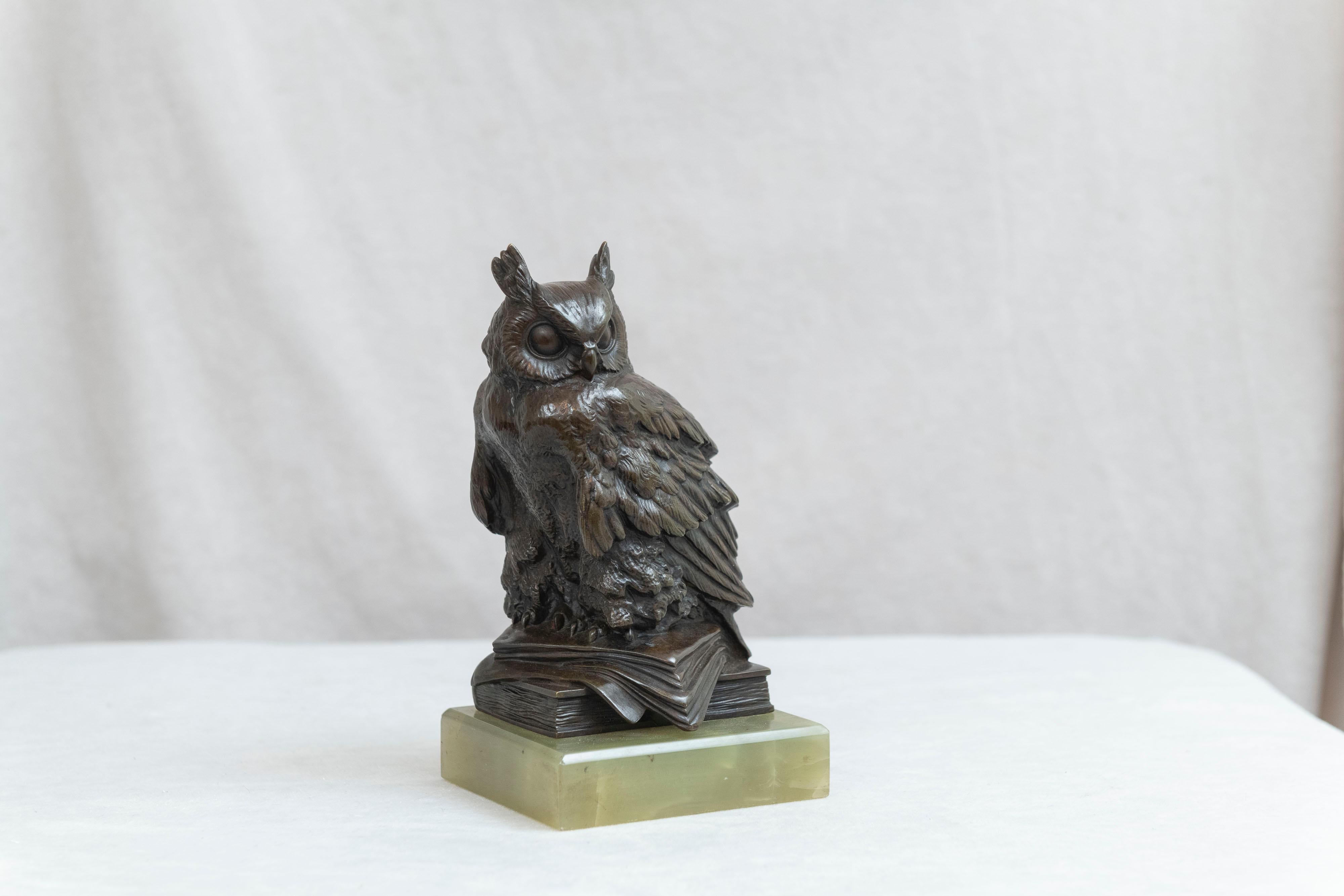 Here we have, in bronze, the wise old owl sitting on top of books representing his wisdom. Mounted on a luscious green onyx base. The casting and rich dark brown factory patina are top quality. We believe this example is Austrian, circa 1910. We