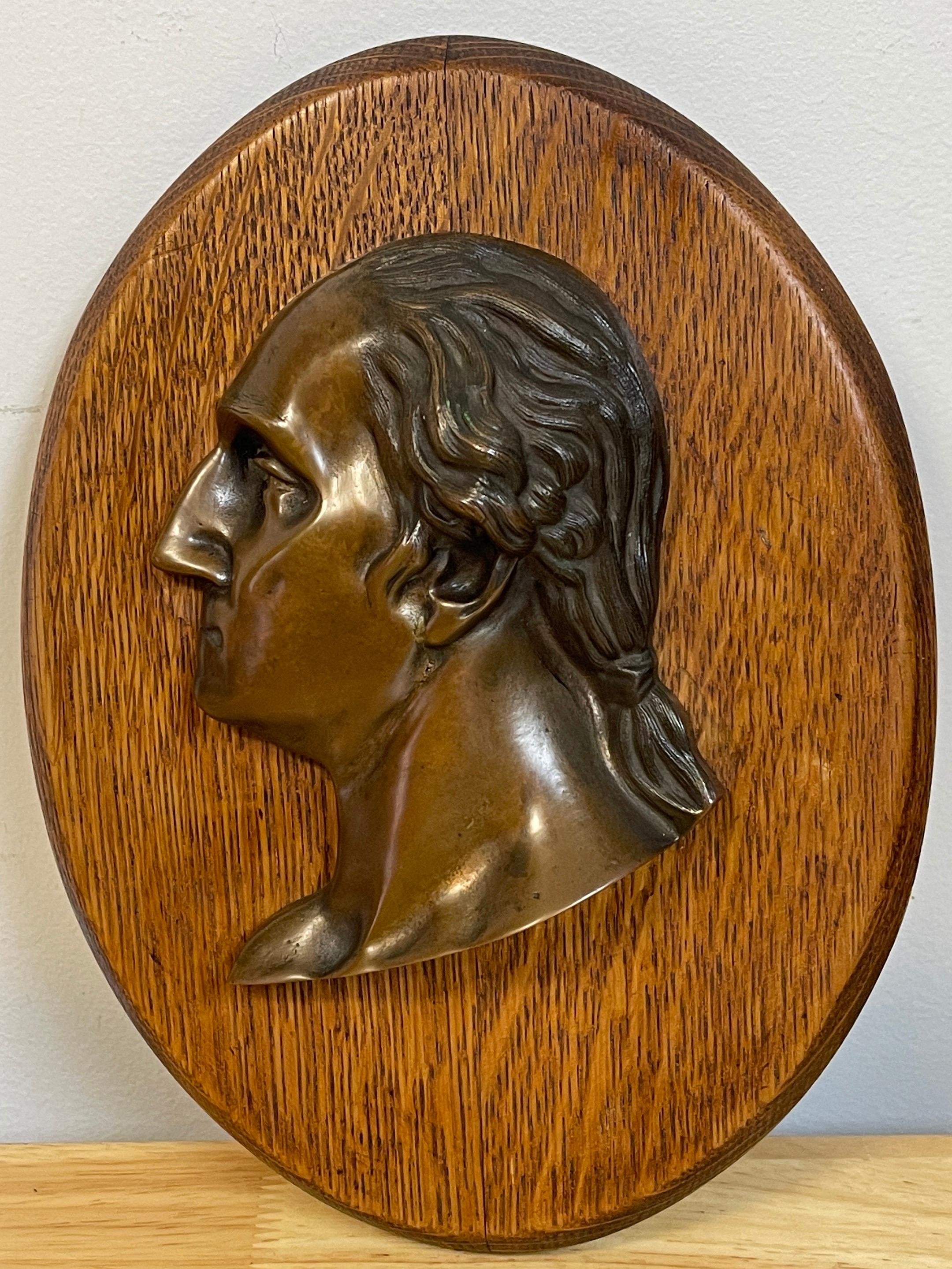 Antique bronze portrait plaque of George Washington, C 1890
Possibly after Jean-Antoine Houdon, finely cast side profile with Washington's hair tied back, mounted on an oval 9