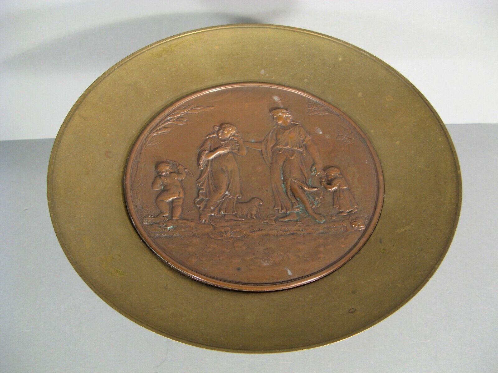 This exquisite coupe, crafted from bronze and copper, showcases a rich Renaissance style. The detailed decor features a charming scene with a couple, a child, and Cupid, embodying themes of love and affection.

Material: Bronze and Copper
Design: