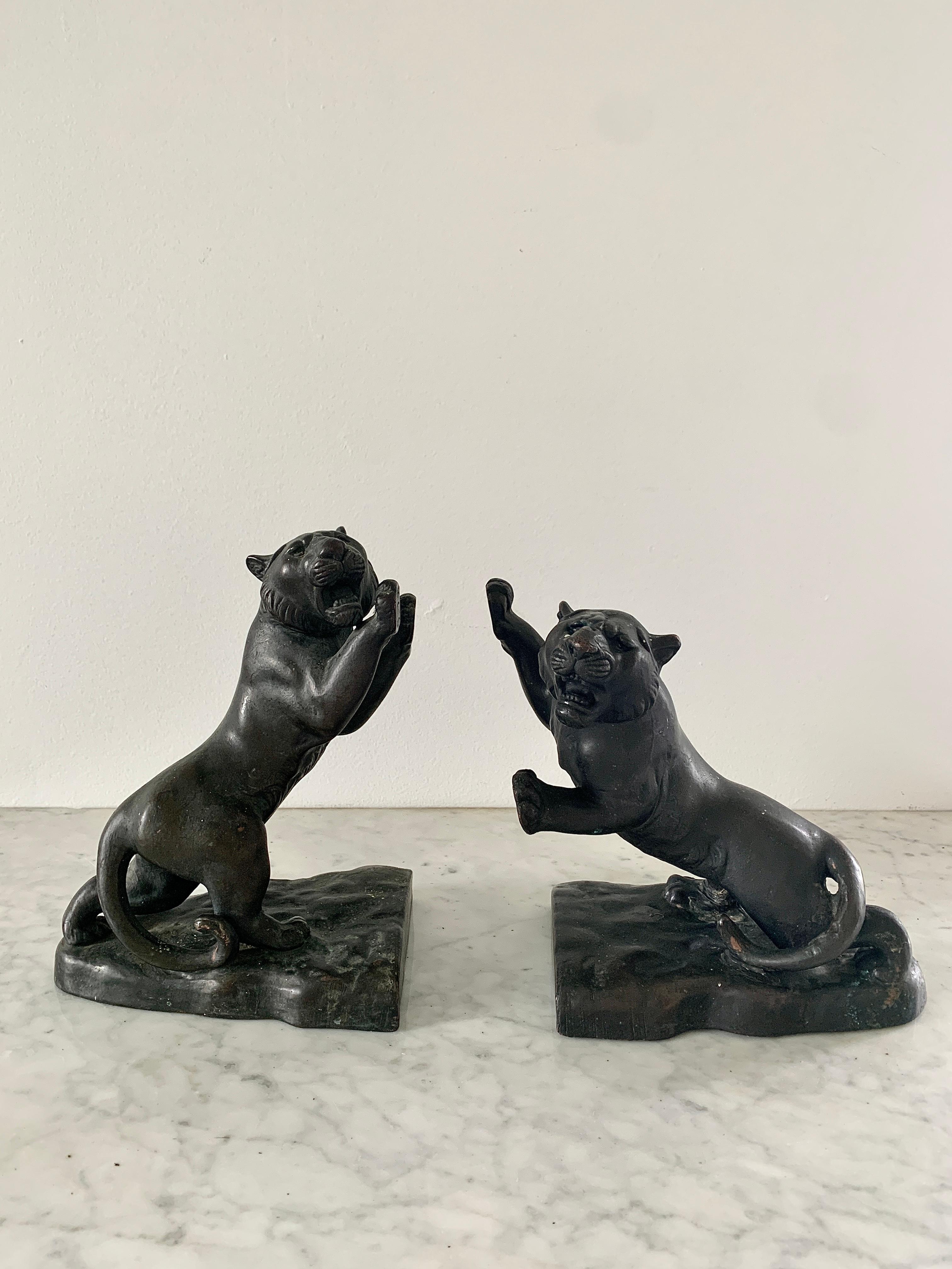 A gorgeous pair of Neoclassical or Grand Tour style bronze bookends in the form of roaring tigers. 

USA, Late 19th century

Measures: 7.75