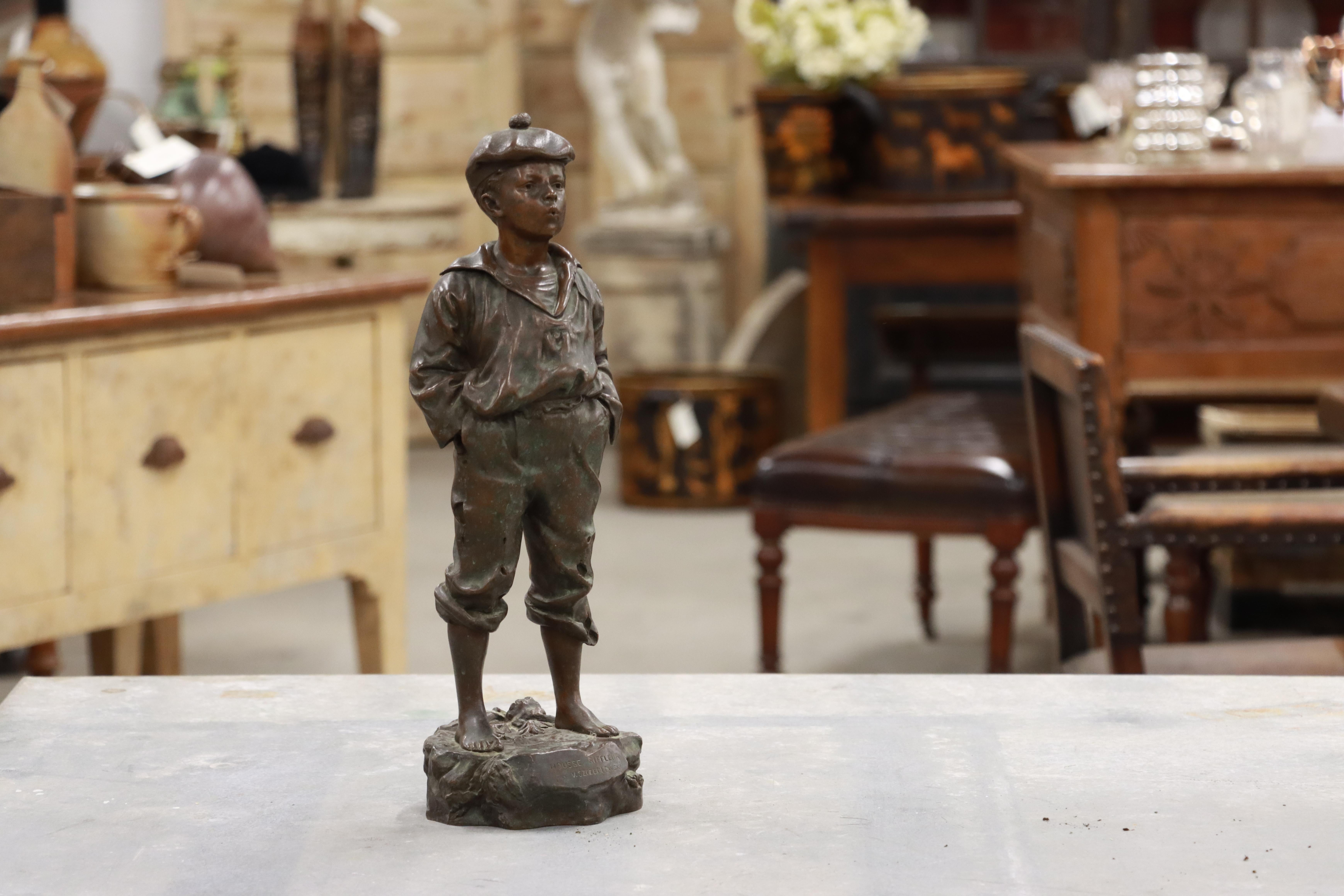 Charming antique patinated bronze sculpture of a young boy 