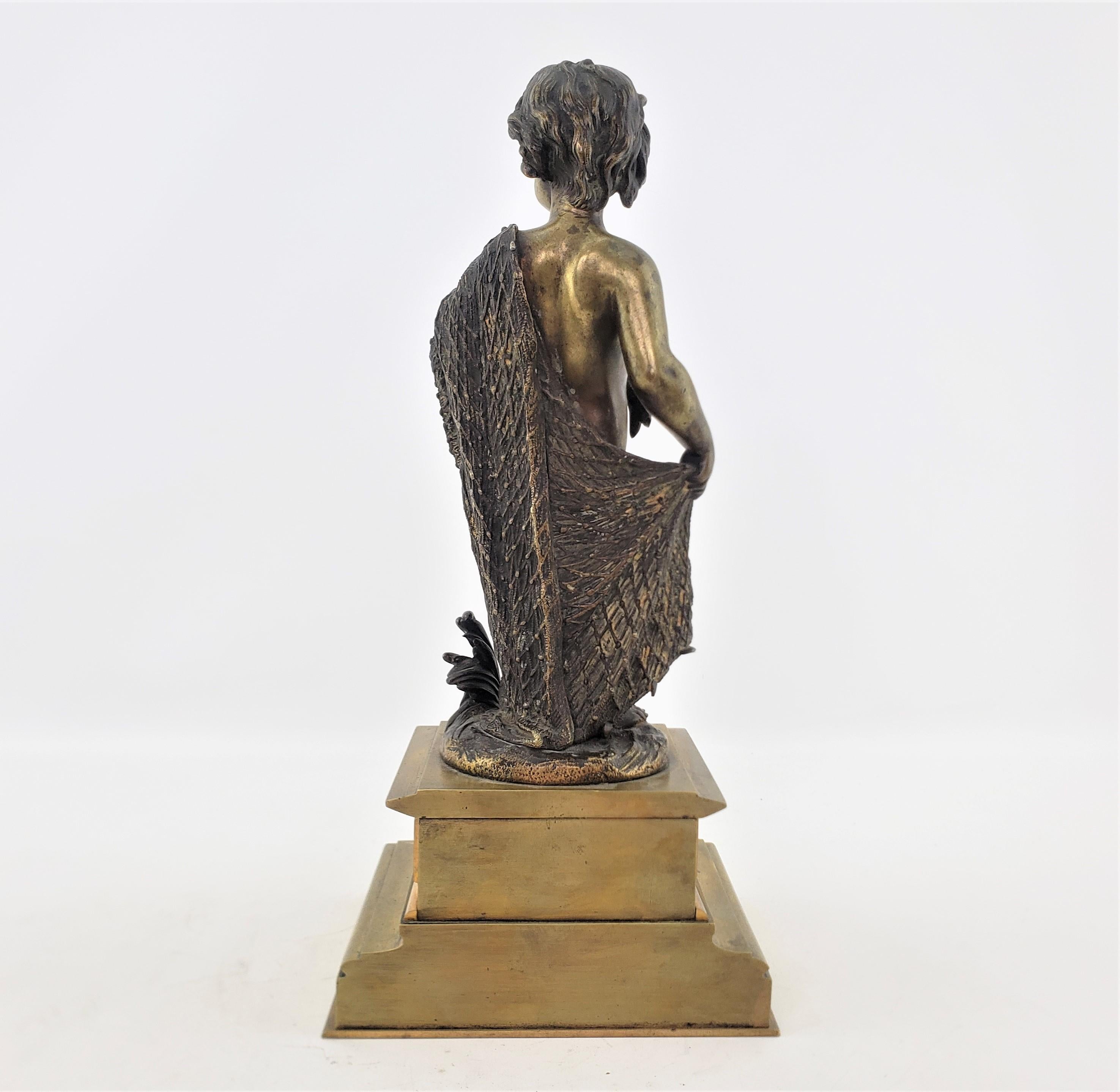Cast Antique Bronze Sculpture of a Child Draped with a Fish Net and Champleve Panels For Sale