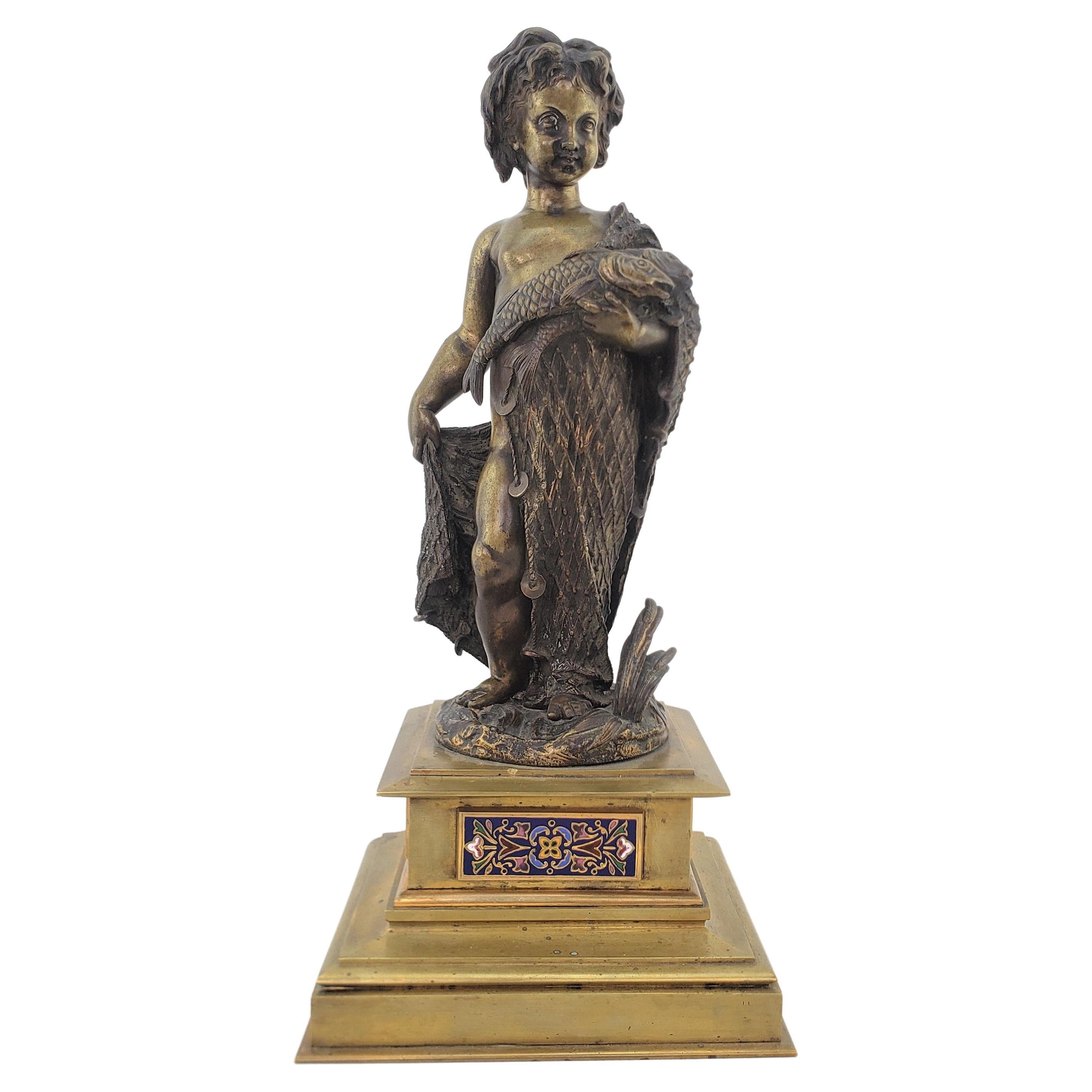Antique Bronze Sculpture of a Child Draped with a Fish Net and Champleve Panels For Sale