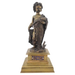 Antique Bronze Sculpture of a Child Draped with a Fish Net and Champleve Panels