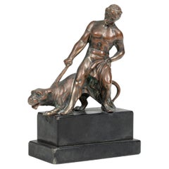 Antike Bronzeskulptur eines Mannes mit Panther aus Bronze