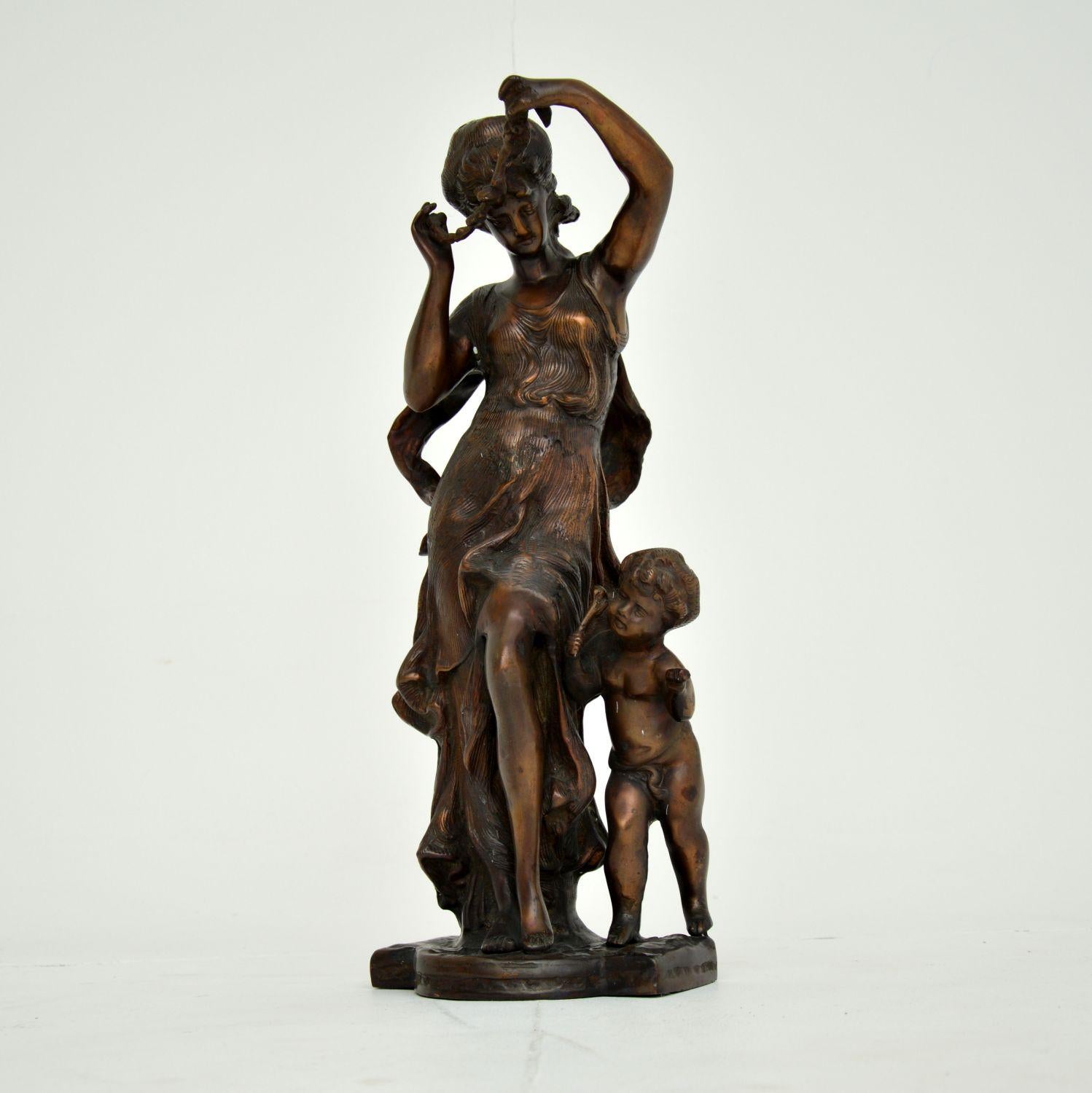 A lovely antique bronze sculpture, depicting a woman and child from classical times. This was likely made in central Europe around the 1930-50’s period.

It is nicely cast with intricate details, and is an impressive size. The bronze has acquired