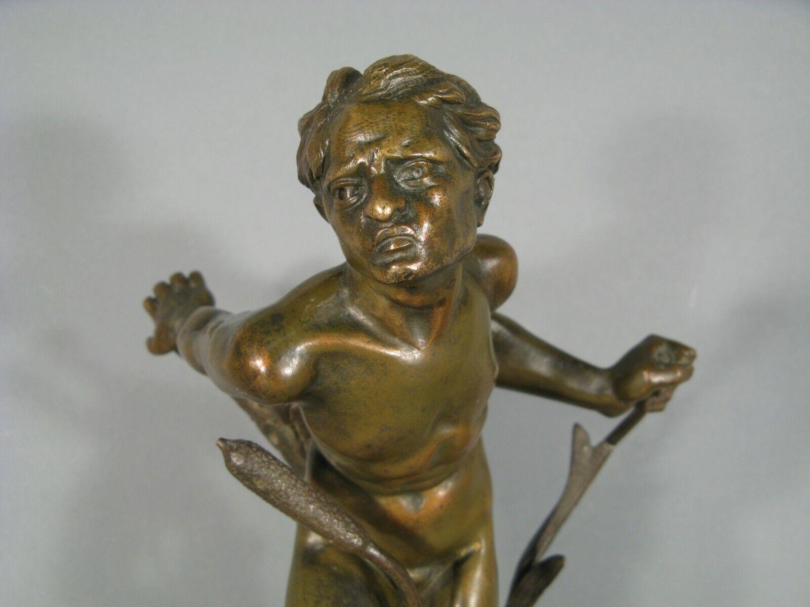 This stunning bronze sculpture, crafted by the French sculptor and painter Alphonse Léon Germain-Thill (1873-1925), represents a young man among reeds. The piece features a green and gold patina and is mounted on a marble base. Signed 