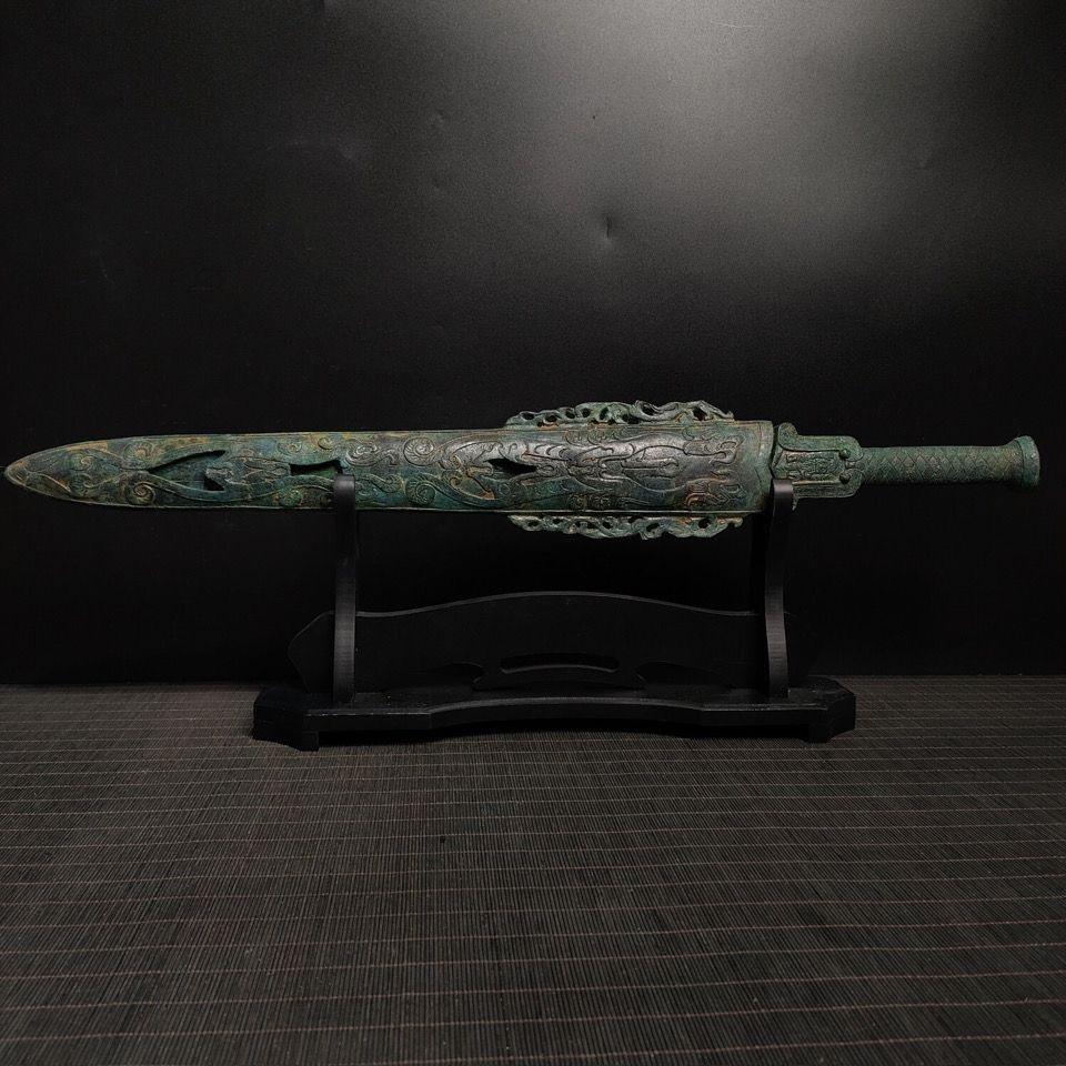 This Antique bronze sword from China with Scabbard and Characters on stem is a truly unique and special collectible piece, the scabbard is engraved with beautiful dragon patterns, and the stem is carved with special characters, the sword is well