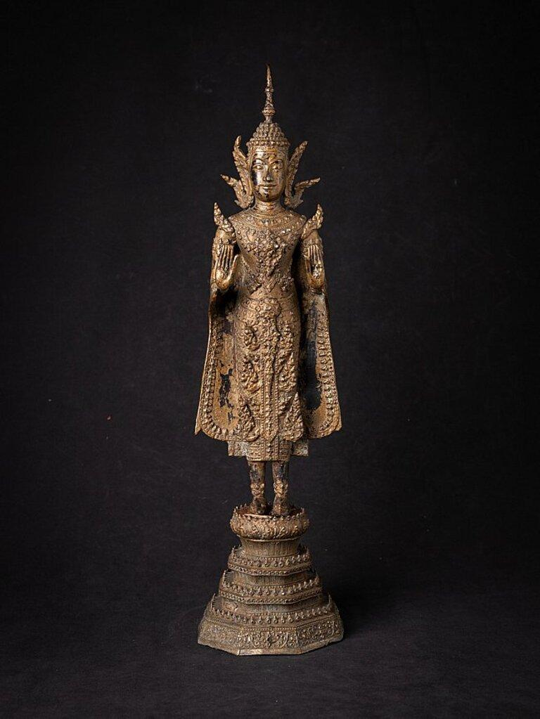 Material: bronze
54,6 cm high 
14,5 cm wide and 14,5 cm deep
Weight: 4.511 kgs
Gilded with 24 krt. gold
Abhaya mudra
Originating from Thailand
19th century
Rattanakosin period.
 