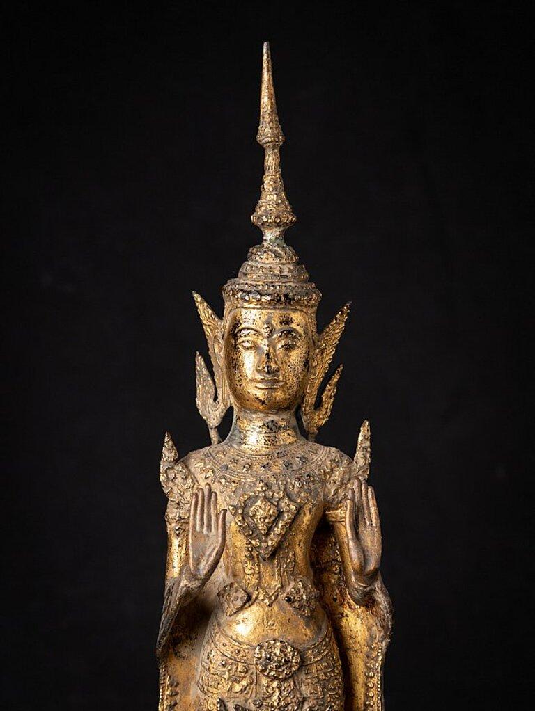 Material: bronze
59,7 cm high 
13,6 cm wide and 13,2 cm deep
Weight: 4.648 kgs
Gilded with 24 krt. gold
Abhaya mudra
Originating from Thailand
19th century
Rattanakosin period.
 
