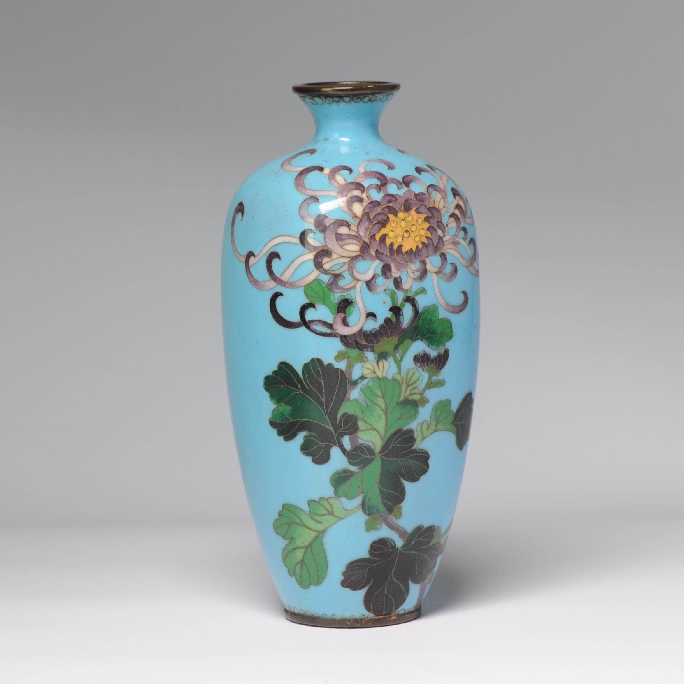 Absolute top Quality vase with superb decoration of flowers

Cloisonné is a way of enamelling an object, (typically made of copper) whereby fine wires are used to delineate the decorative areas (cloisons in French, hence cloisonné) into which