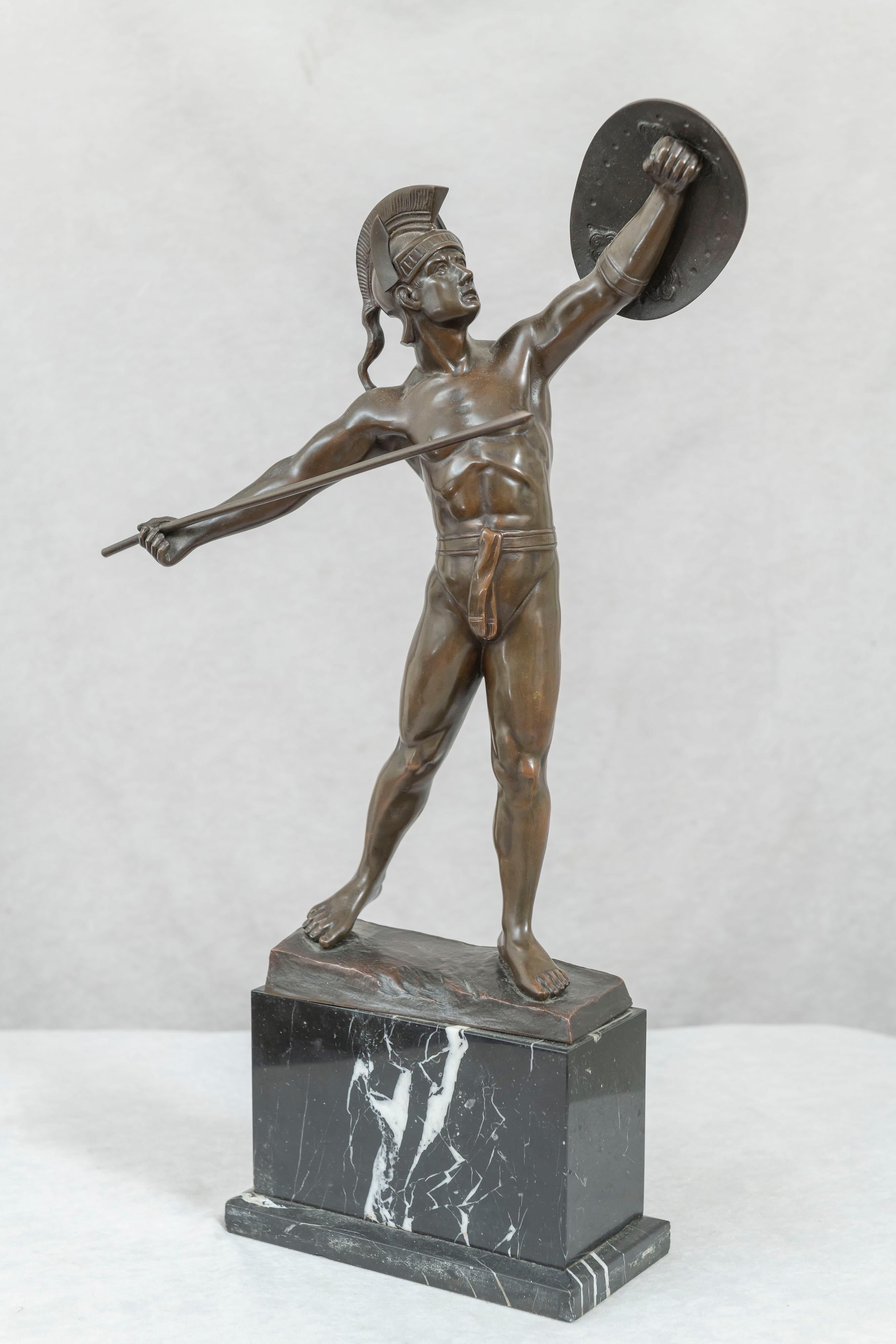 This handsome young man is in an appropriate pose as he goes into battle. Rich brown patina, fine detailed casting, and beautiful marble 2 tiered base. It is signed along the bottom edge of the bronze. A fine example of a very collectible genre of