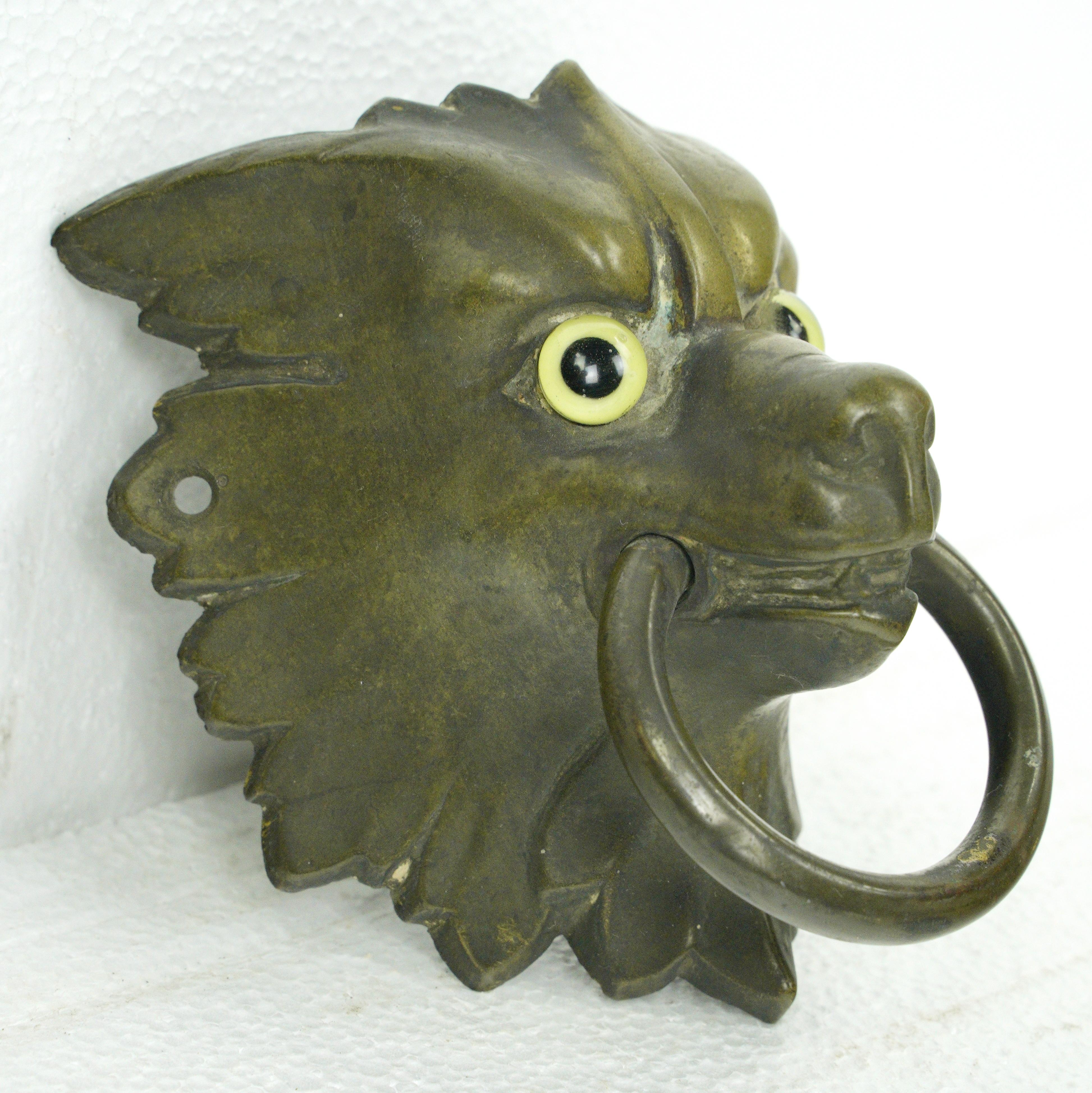 Solid bronze wolf head ring pull with piercing glass eyes. Good condition with appropriate wear from age. One available. Please note, this item is located in our Scranton, PA location.