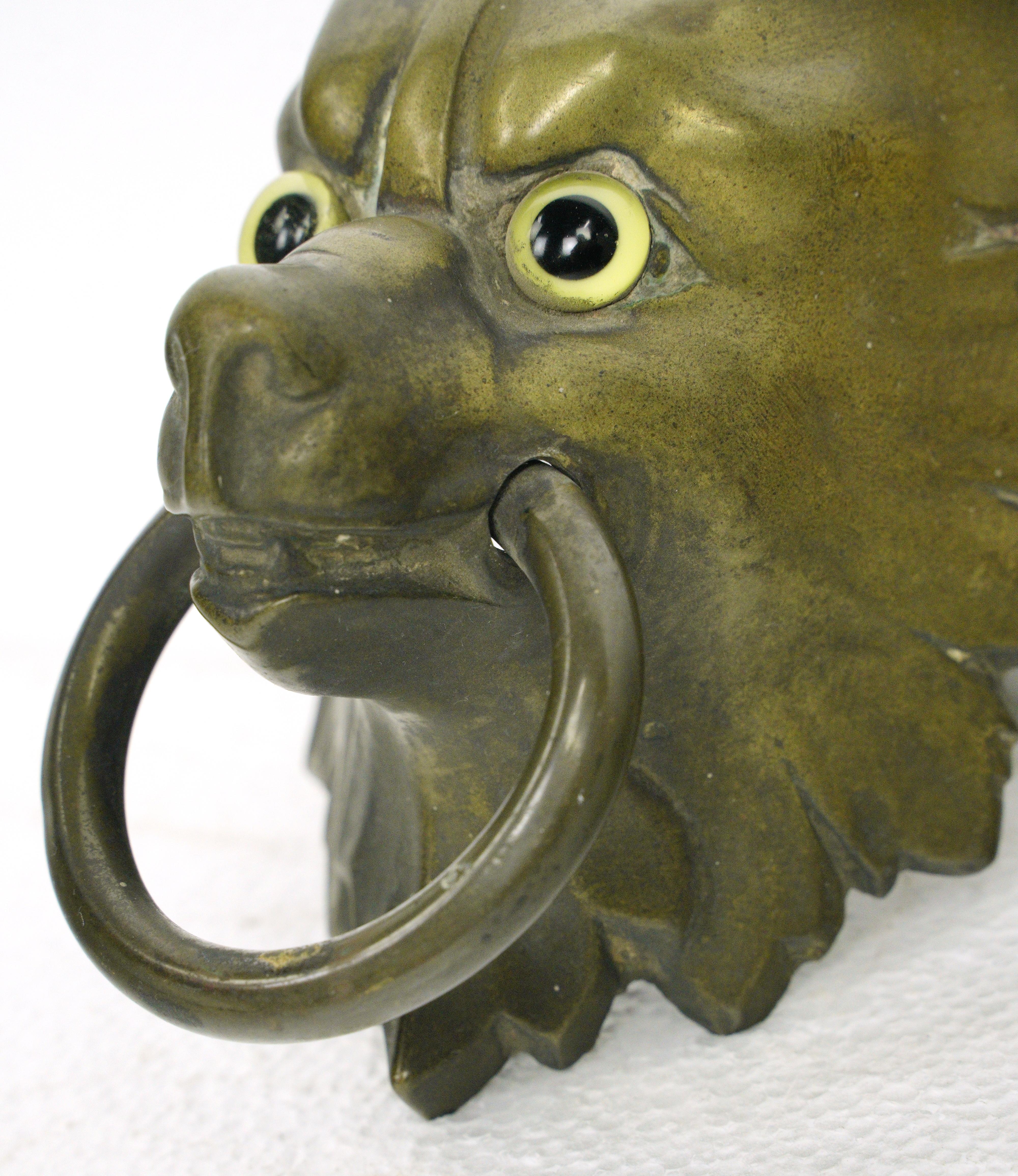 20th Century Antique Bronze Wolf Head Glass Eyes Ring Pull For Sale