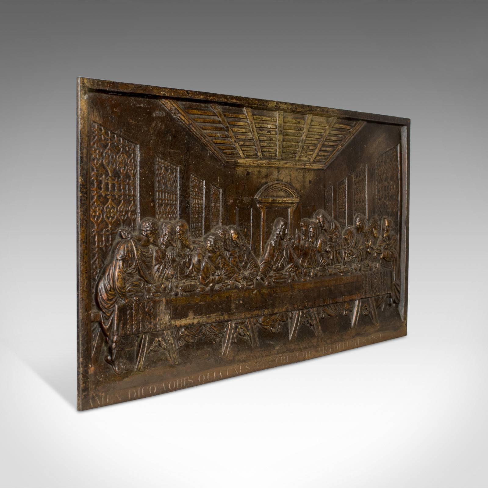 This is an antique bronzed iron plaque depicting the Renaissance master, Leonardo Da Vinci's 'The Last Supper'. An English fireback or wall decoration dating to the late Victorian period, circa 1890.

Astonishing detail for an iron cast
Bronzed
