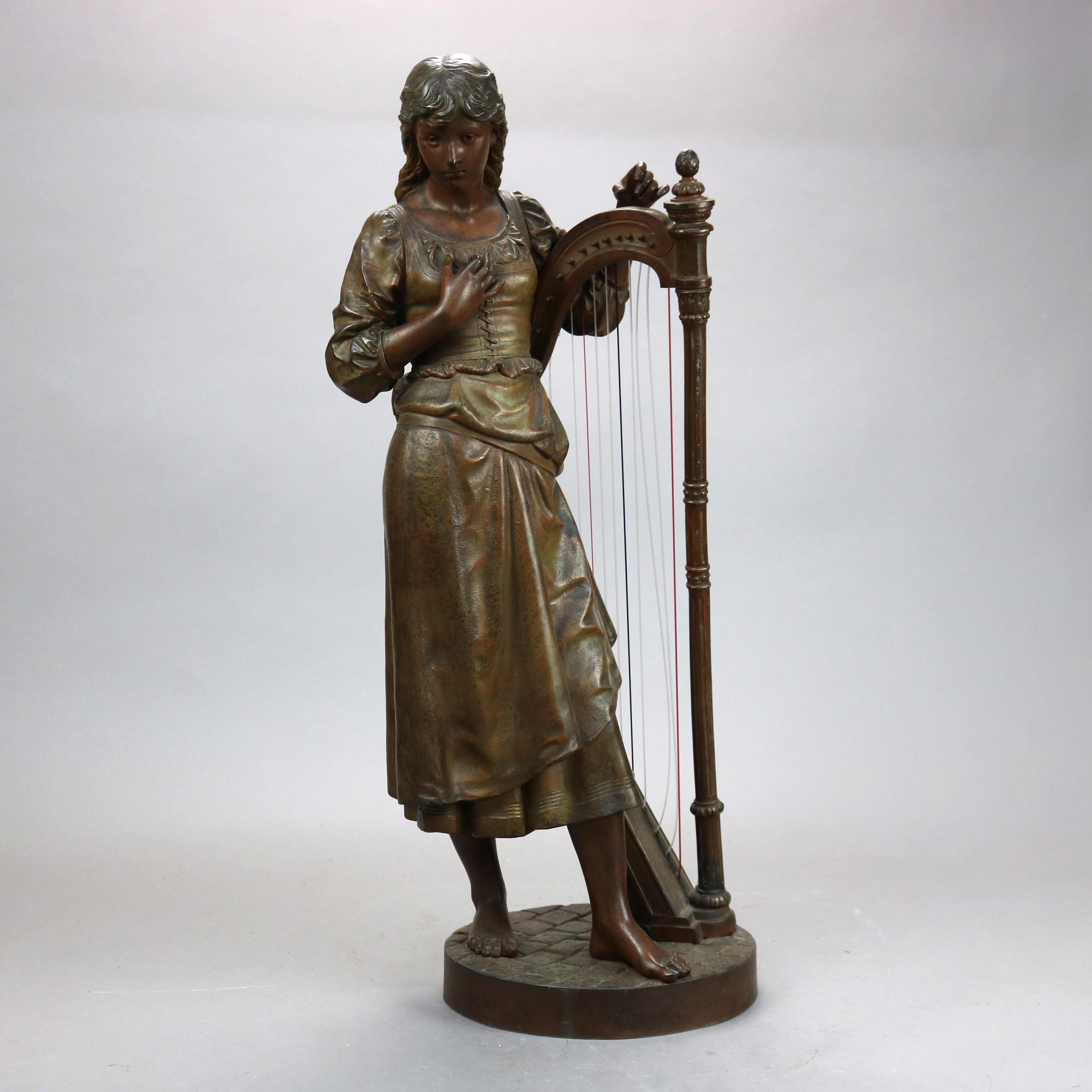An antique figural sculpture offers bronzed cast metal of a woman with her harp, 19th century

Measures - 26.75''H x 14''W x 8.5''D.