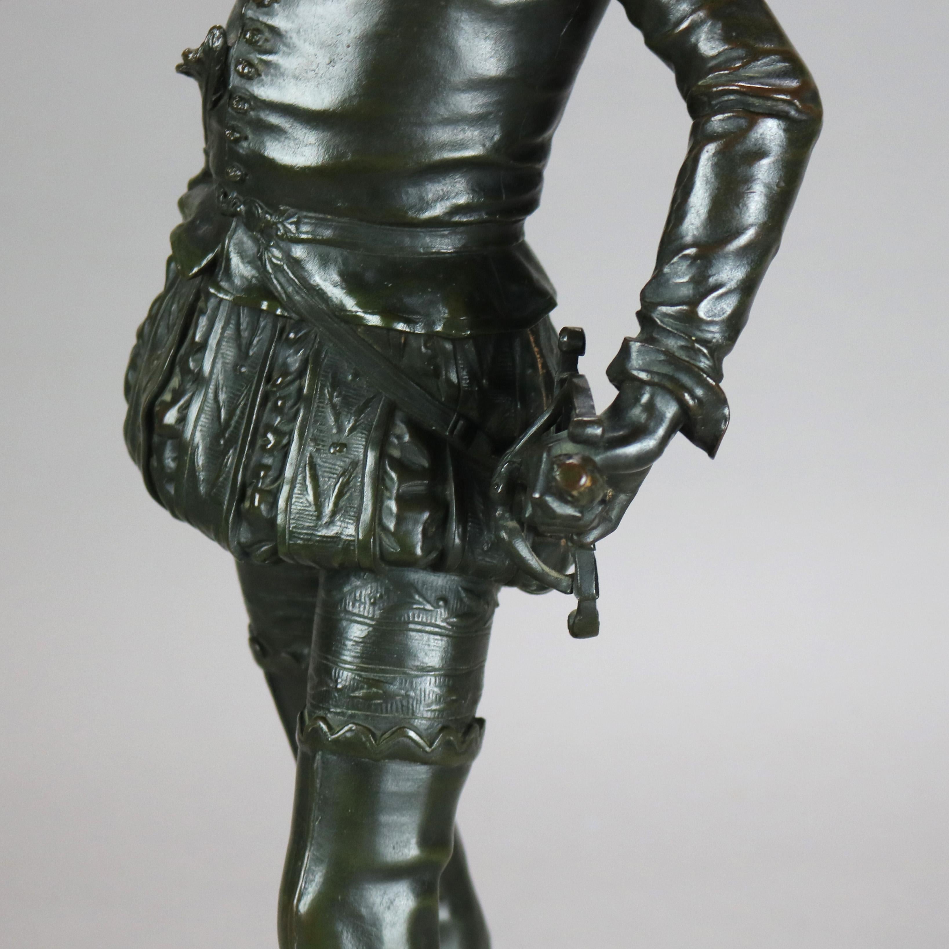 Sculpture ancienne en métal bronzé représentant un jeune courtisan brandissant une épée, signée Rambaud 7