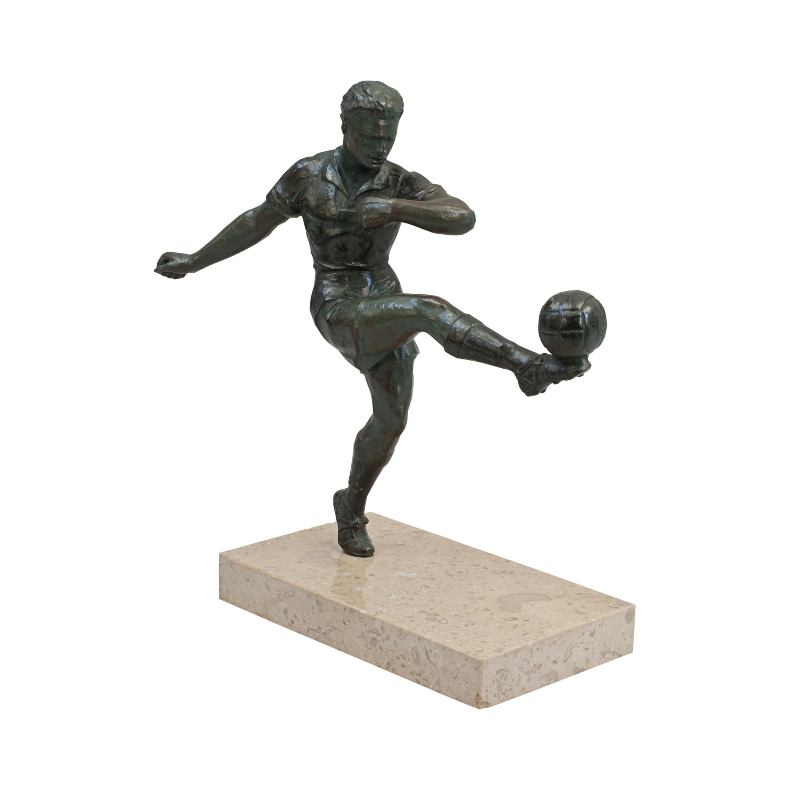 Antique bronzed spelter football figure.
A very nice French Art Deco style spelter figure of a footballer. The footballer is kicking a football with his right foot and has a verdigris finish to look like weathered bronze. The figure is mounted on a