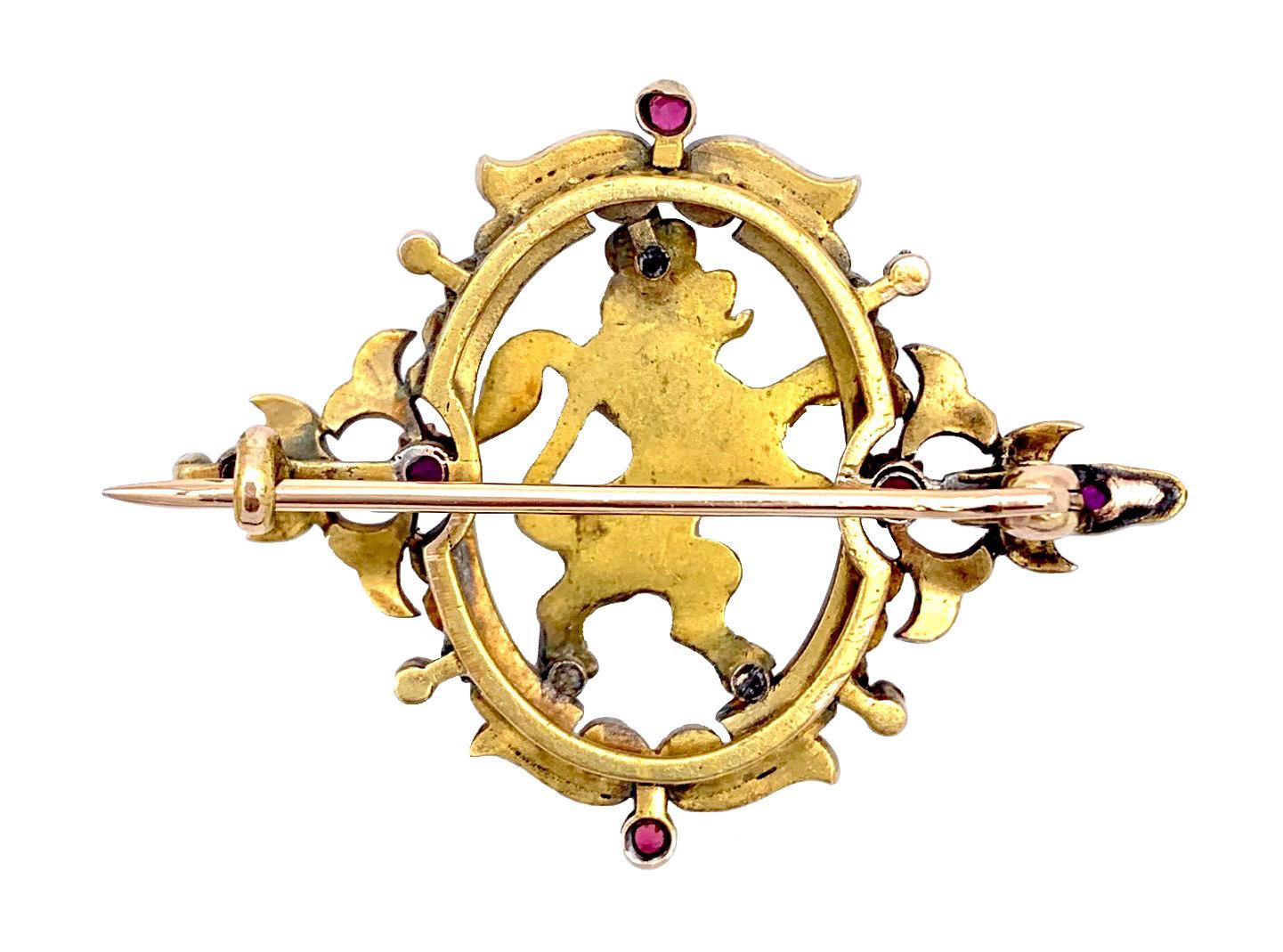 This handcrafted 14 karat gold brooch was a present given by the Bavarian Court to a loyal subject for special achievements.
The striding lion is decorated with diamonds and rubies. It is surrounded by an ornamental frame set with natural pearls and