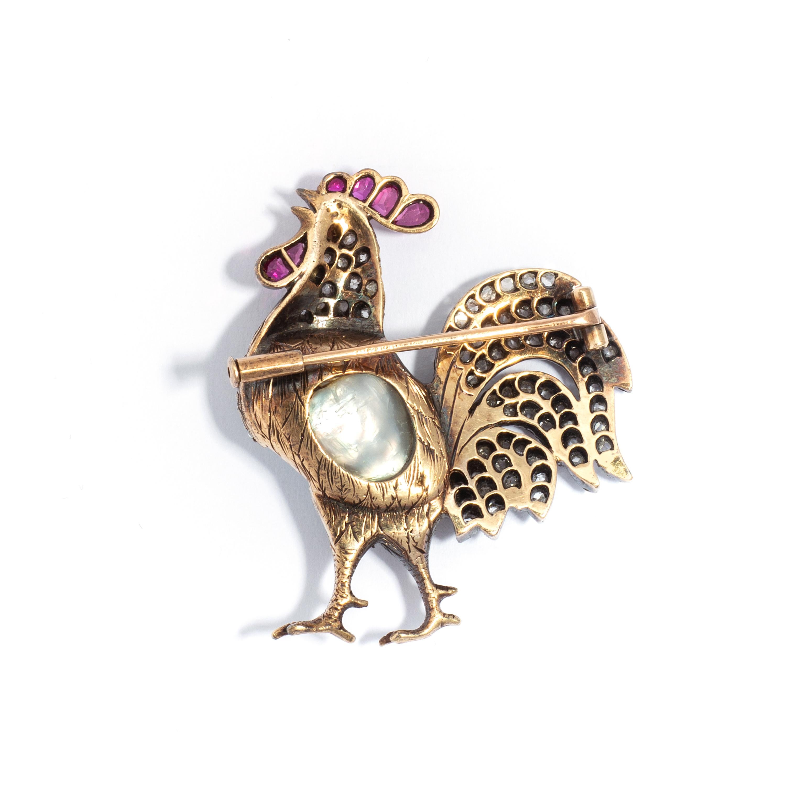 Brooch cock with a pearl rose cut diamond and ruby on gold. Total 20.25 carats approximately. 
Early 20th century.

Height: 1.58 inches (4.00 centimeters)
Width: 1.38 inch (3.5 centimeters)