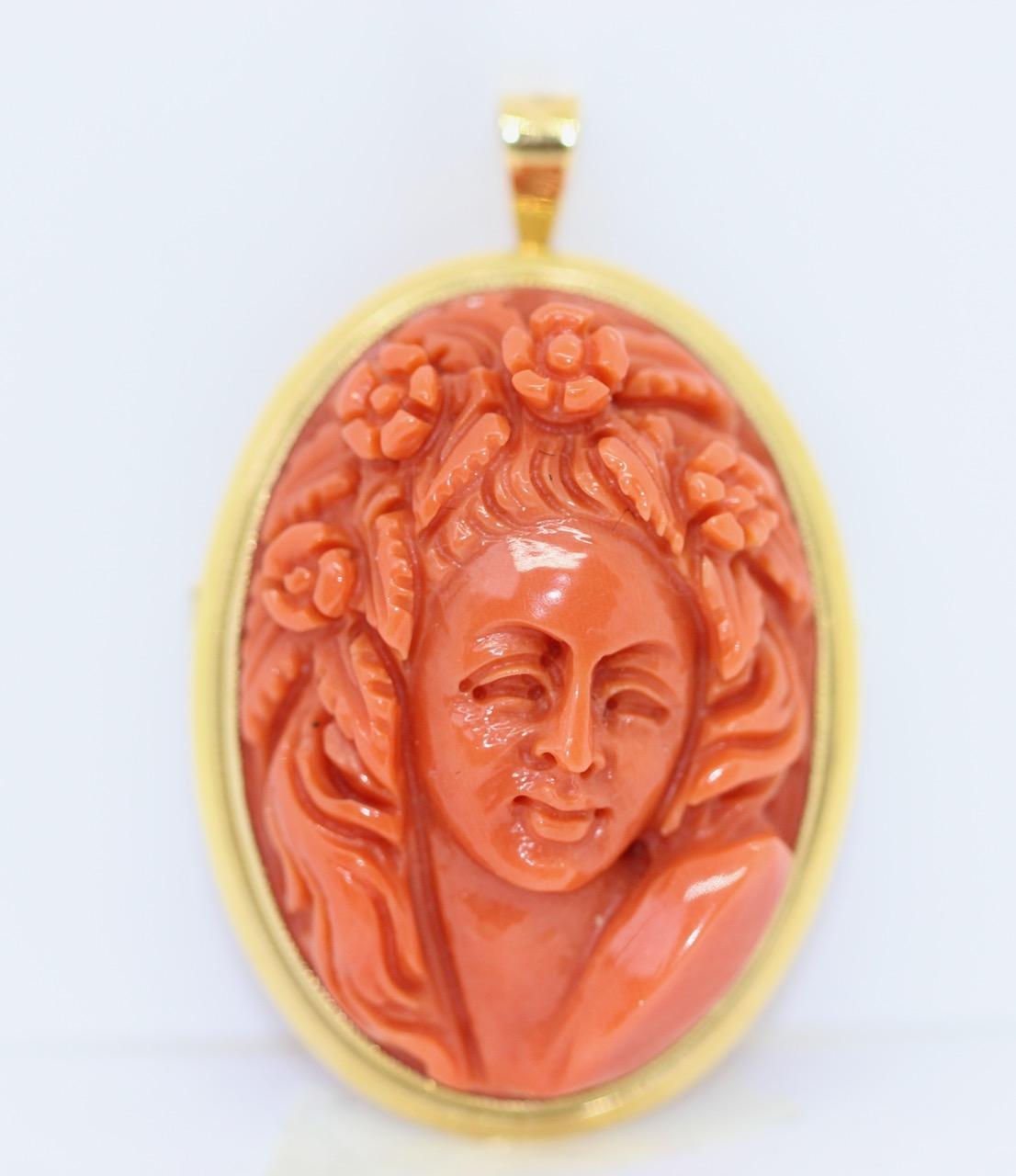 Antique brooch or pendant, coral cameo, 18k gold, female portrait

We also have the matching ring on offer.

Dimensions measured without eyelet.
Includes certificate of authenticity.