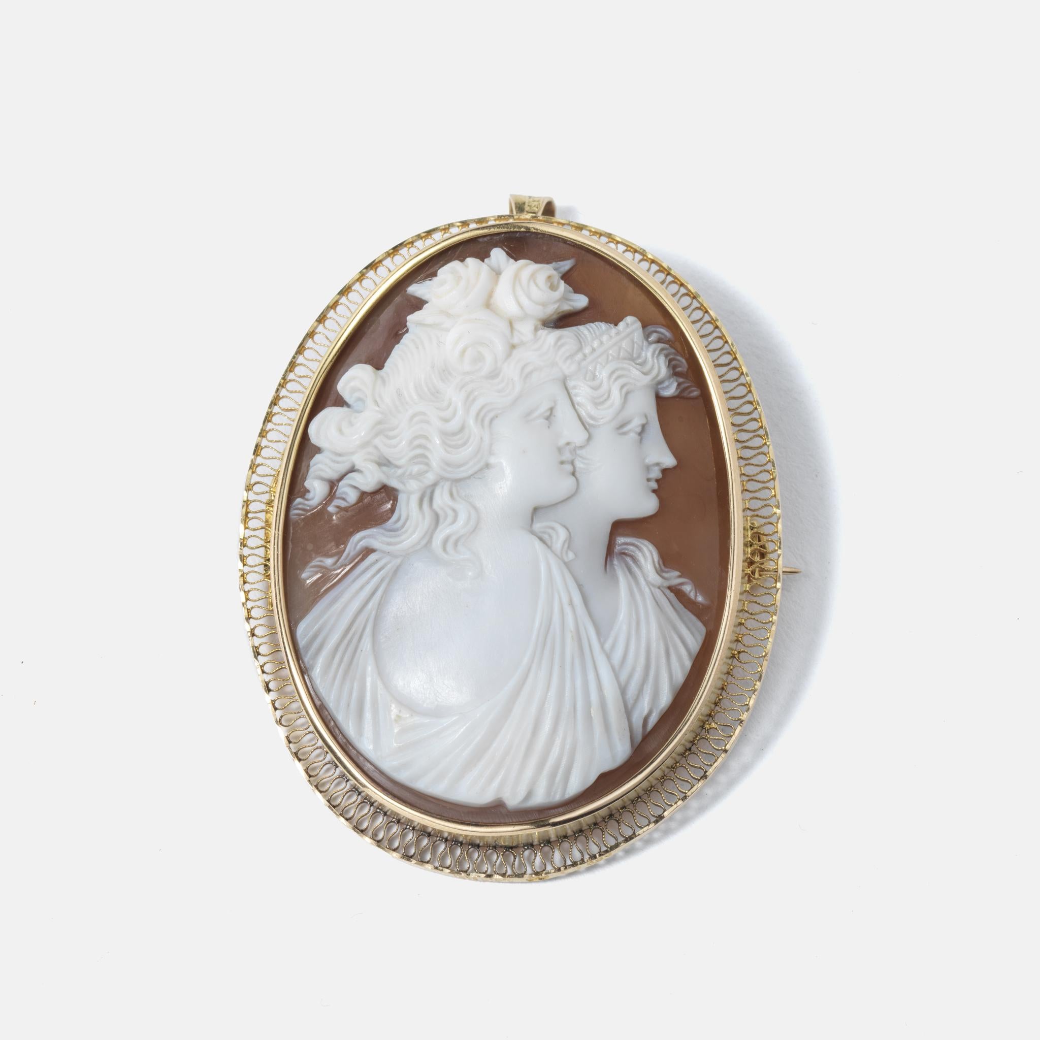 This 18 karat gold brooch/pendant is adorned with a shell cameo which features stunning details, beautiful, strong women in profile. The brooch/pendant has a classic look making it available for all preferences.

This is a quite large piece of