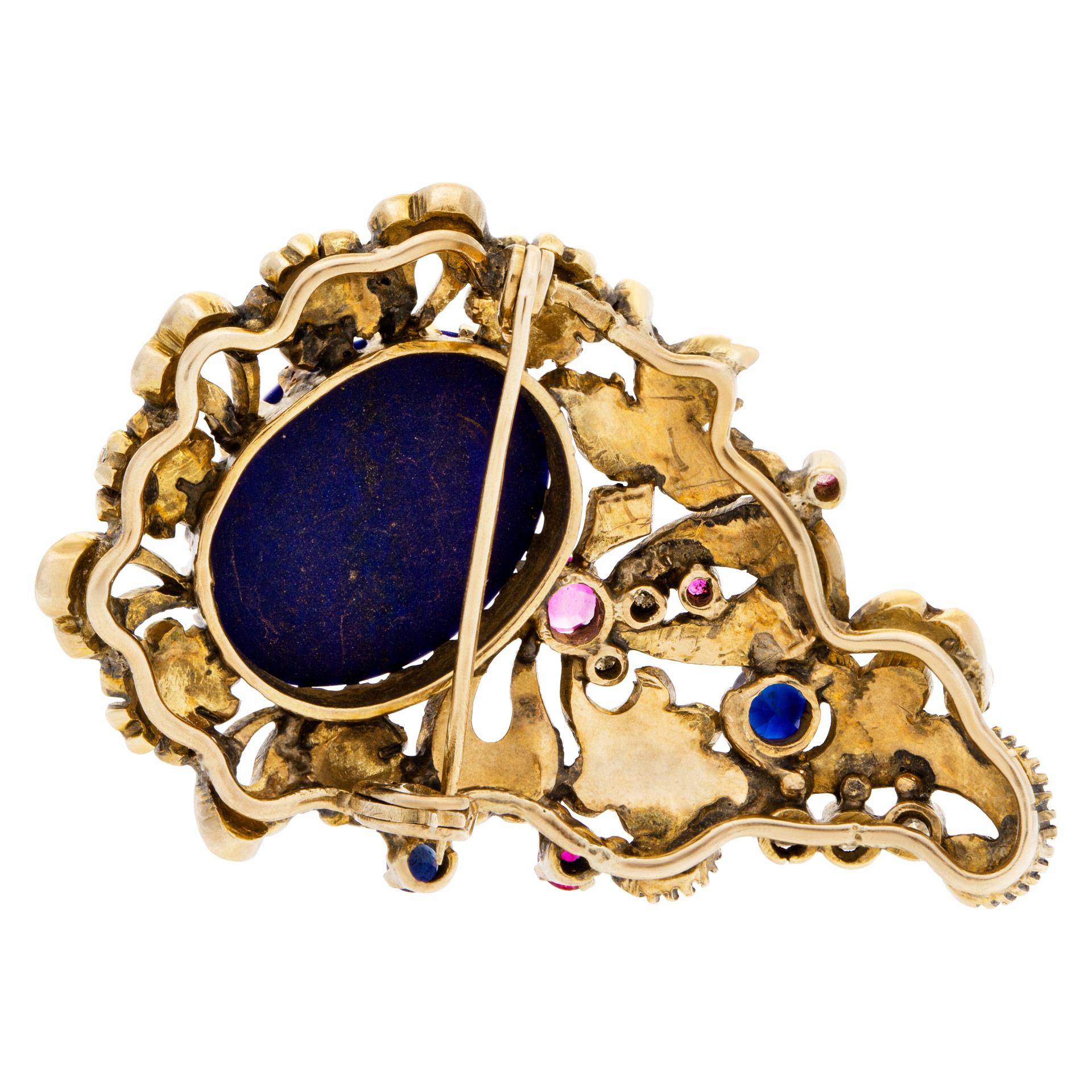 ESTIMATED RETAIL: $5,400 YOUR PRICE: $3,540 - Antique Brooch with cabochon lapis lazuli center and rose & cushion cut diamonds set in 14K gold. Secured C clasp dates the brooch prior to 1900. 4 little rubies, blue sapphire, some black enamel