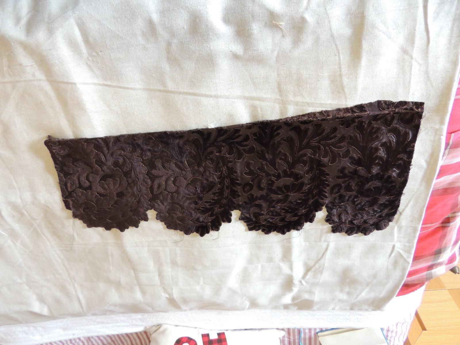 Antique brown applique textile fragment
Size: 27