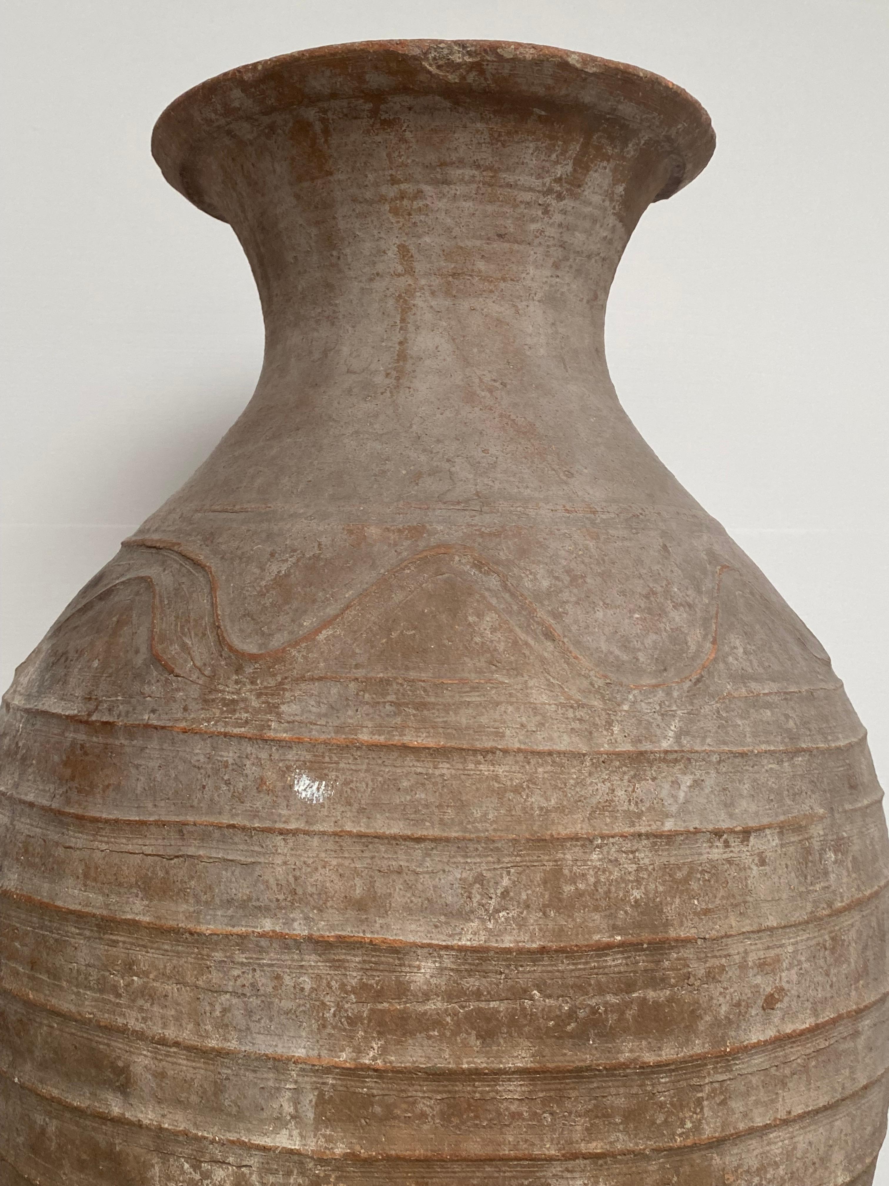 Large,antique and very elegant Terracotta Vase from Iran,1920
Good, great antique patina of the terracotta,
Decorated with simple lines and motifs,
Great shine of the different variety of the brown colors,
An antique urn full of charm and