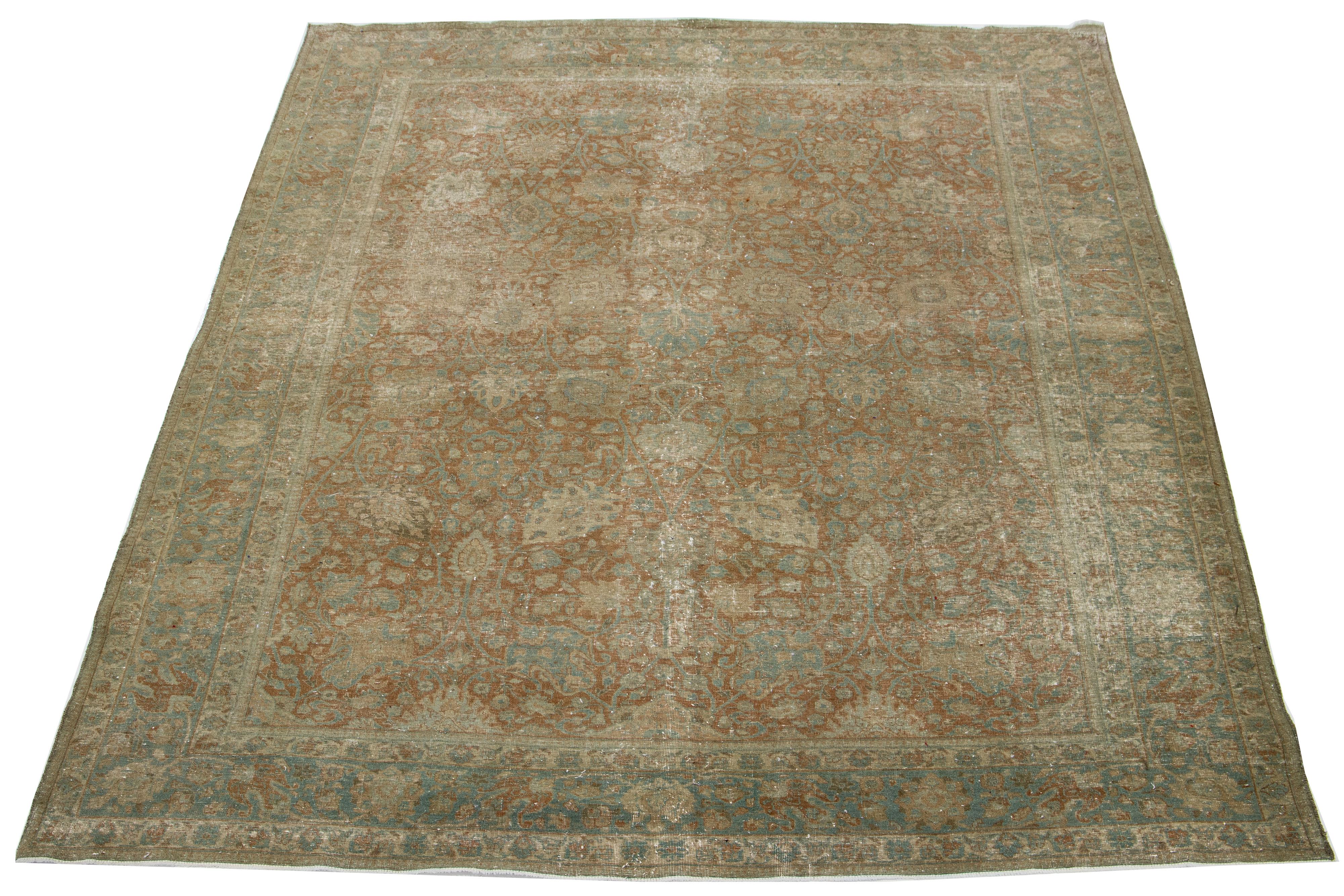 This beautifully handcrafted Persian Tabriz wool rug displays a classic all-over floral pattern. The brown background features shades of blue and beige.

This rug measures  8' x 10'4'.

Our Rugs are professionally cleaned before shipping.