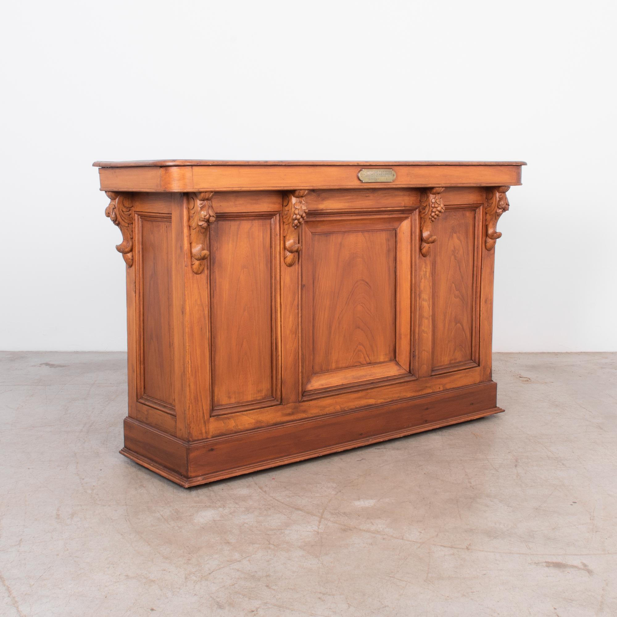 This Belgian style shop counter was built from a cafe in Brussels, circa 1900. Rounded profile and counter shape is carved from a well toned European Ash, great carved fruit motif suggest the original location of this counter. The back has been