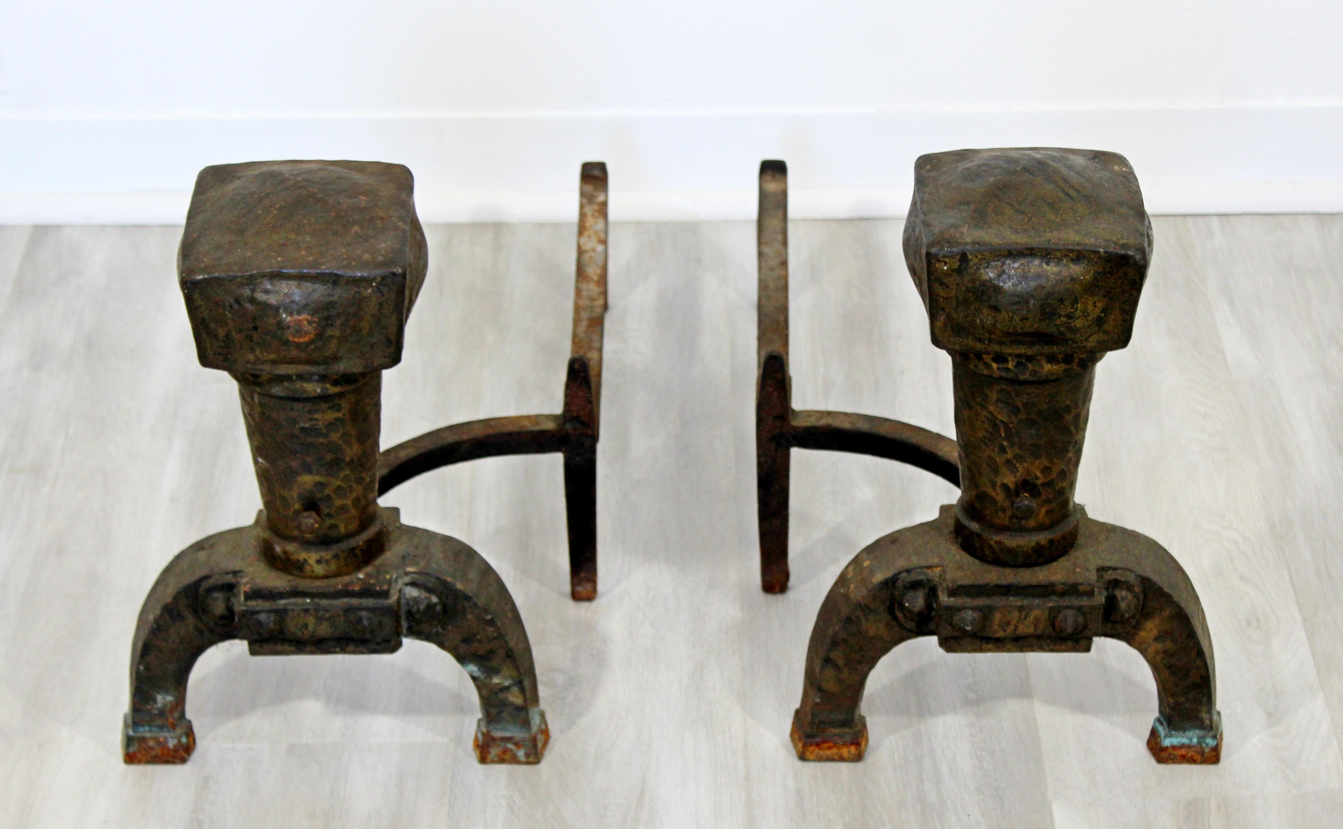 For your consideration is a magnificent pair of antique, Brutalist, iron andirons. In excellent condition, with age appropriate wear and patina. The dimensions of each are 12
