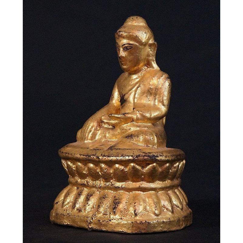 Material: wood
18 cm high 
13 cm wid
Weight: 0.284 kgs
Gilded with 24 krt. gold
Bhumisparsha mudra
Originating from Burma
19th century
With hollow space in the backside of the base

