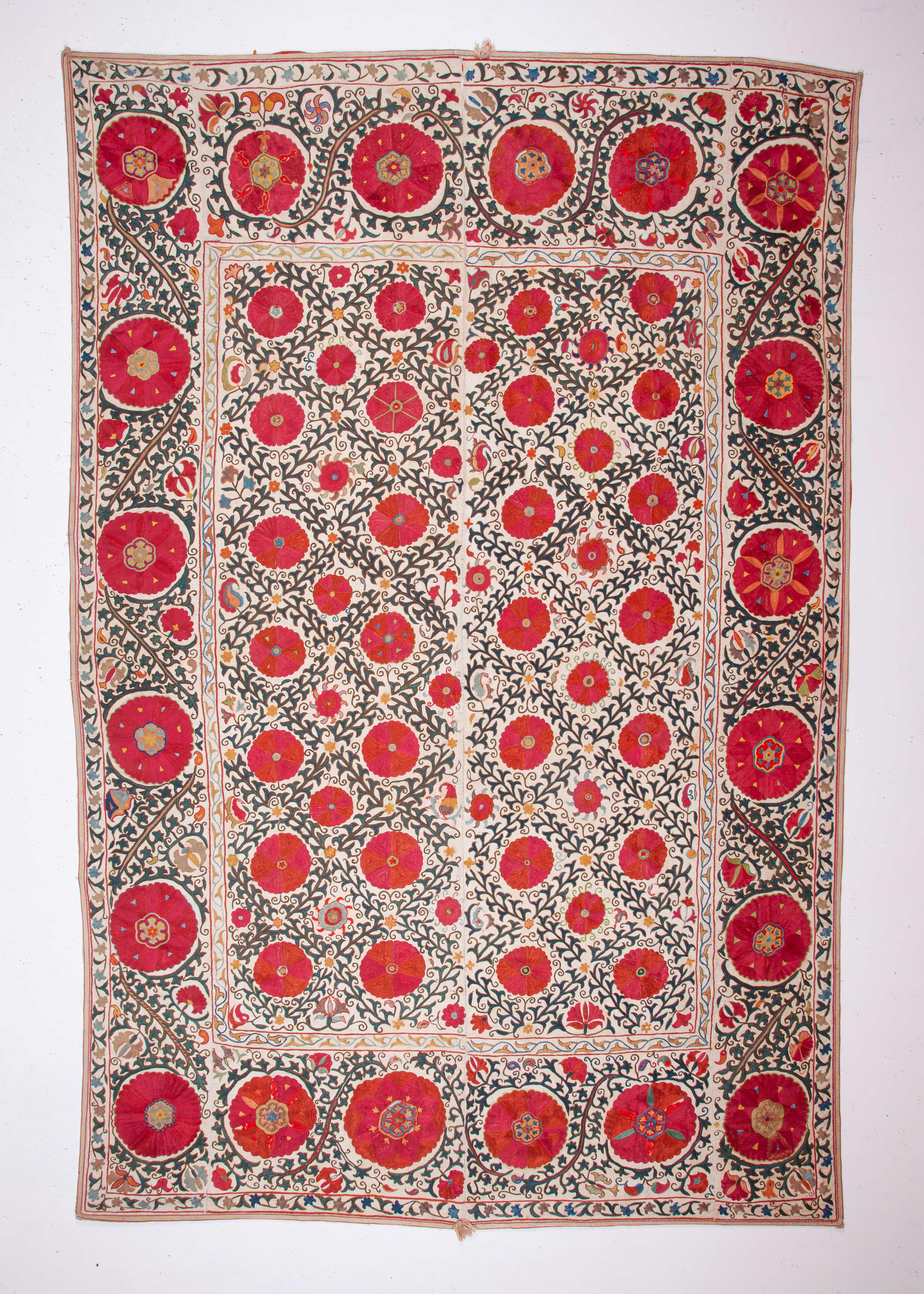 Good Uzbek suzanis are famous with their color, workmanship and silk quality.
Here is a first class example.
 