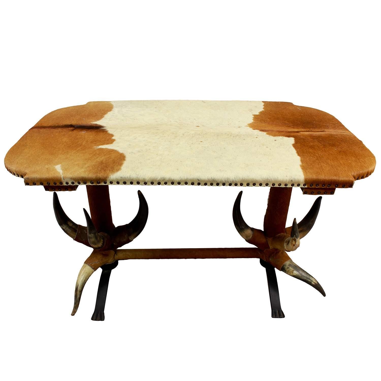 Antique bull Horn table ca. 1870

The bull horn table is covered with vintage cattle coat which has to be renewed (is loosing the hairs). The iron legs are added to improve stability. It was manufactured in Austria ca. 1870.

Antler furniture have