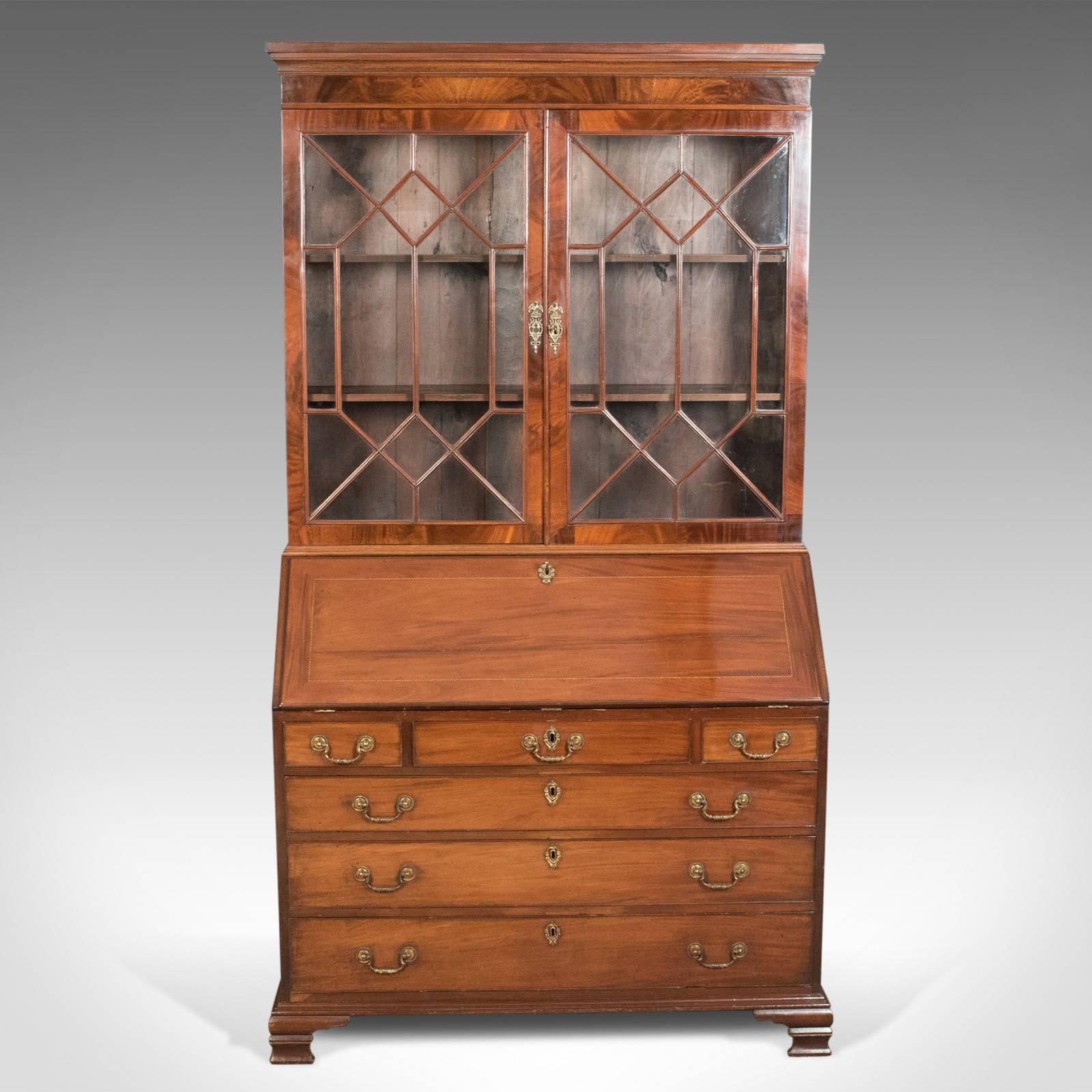 This is an antique bureau bookcase, an English, late Georgian, mahogany writing desk, circa 1800.

A very fine bureau bookcase in flame mahogany displaying good color and grain interest
Featuring good proportions, useful storage, generous