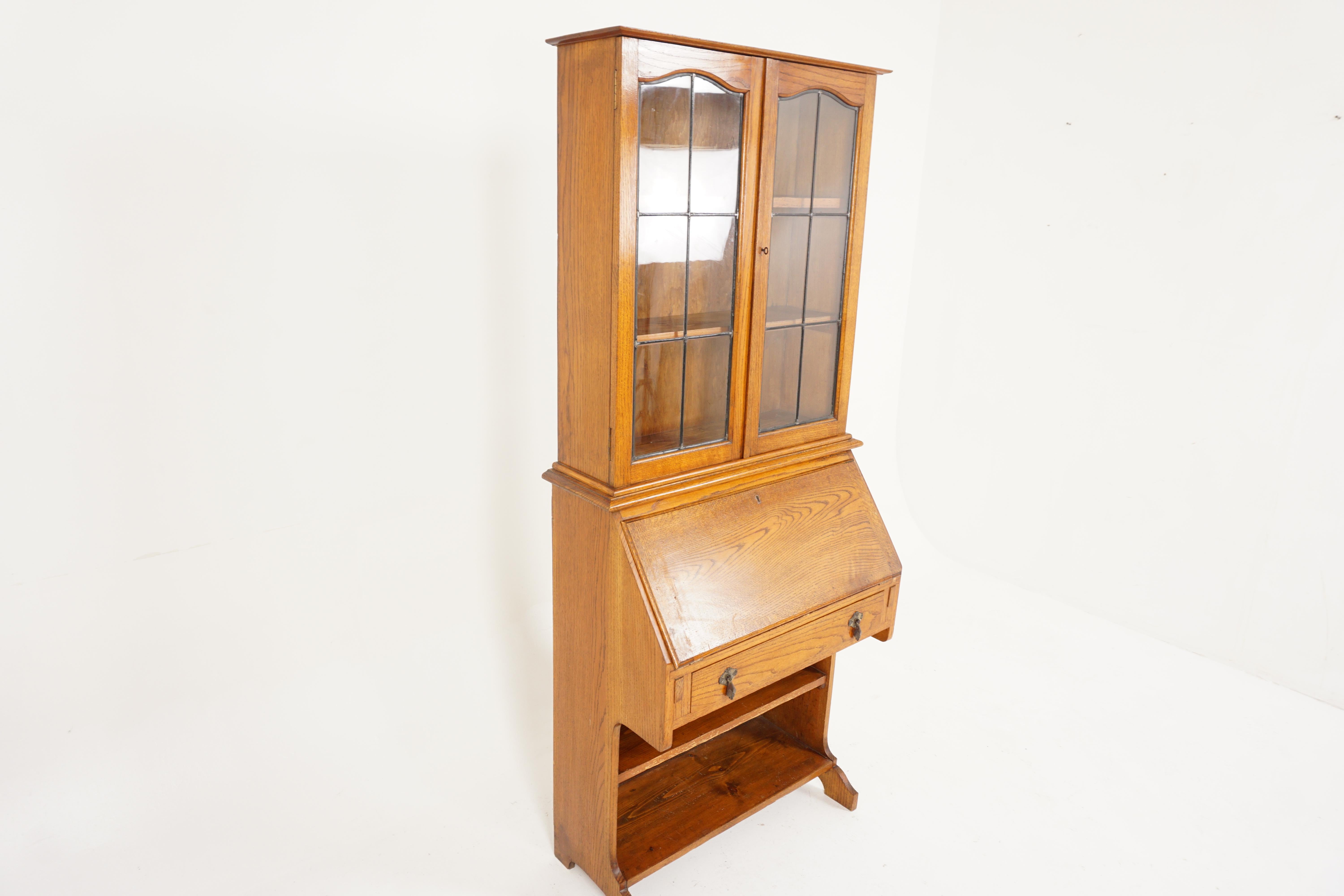Antique Bureau bookcase, Slant front desk, bookcase top, Scotland 1910, H244

Scotland 1910
Solid oak
Original finish
The top with glass doors and stitched interior
The fall front opening to reveal interior fitted with cubby holes and drawers
Single