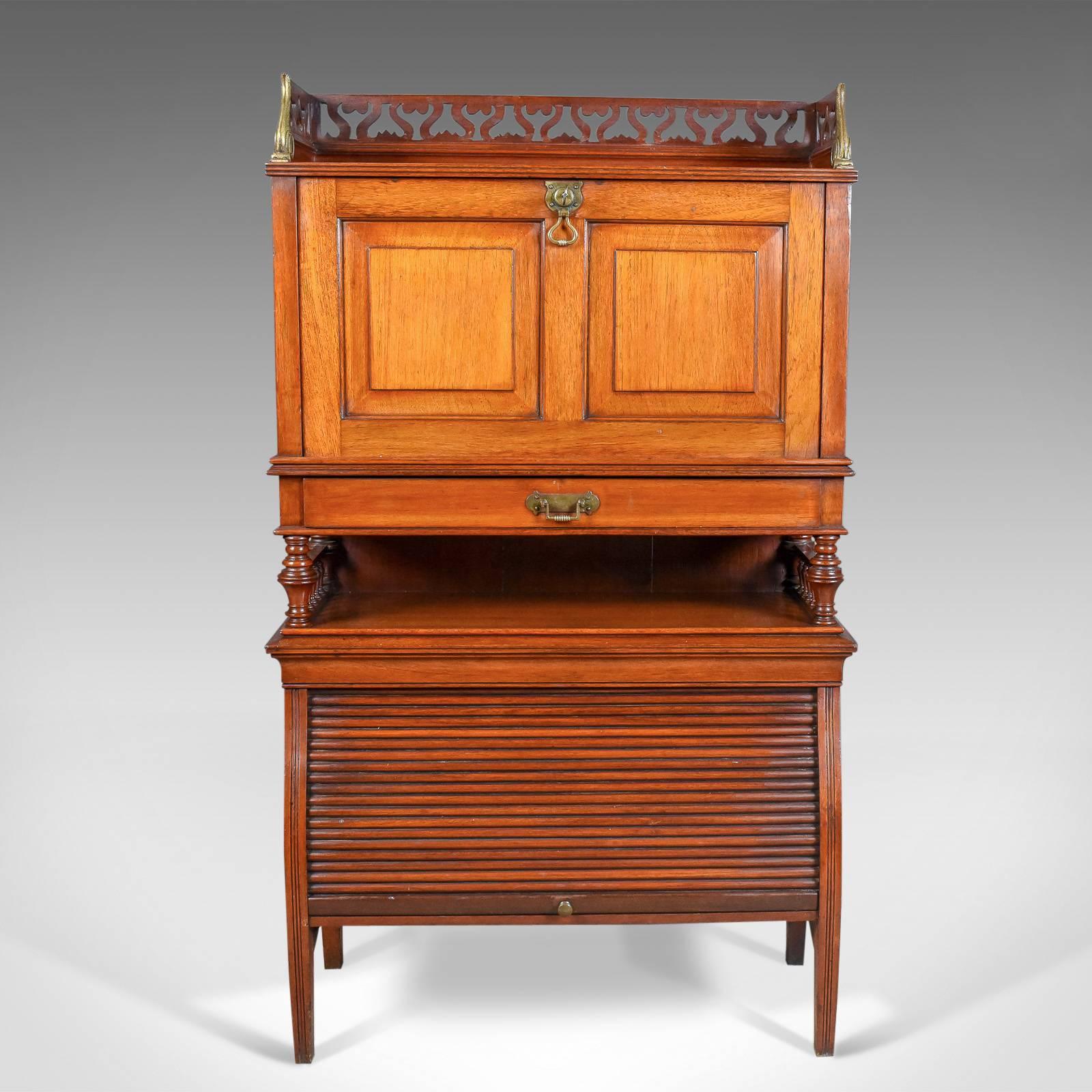 This is an antique bureau cabinet, an English, Edwardian, walnut cupboard dating to, circa 1910.

A craftsman's piece in solid walnut
Delightful coloration and desirable aged patina
Of good proportion and practical use.

Standing upon square