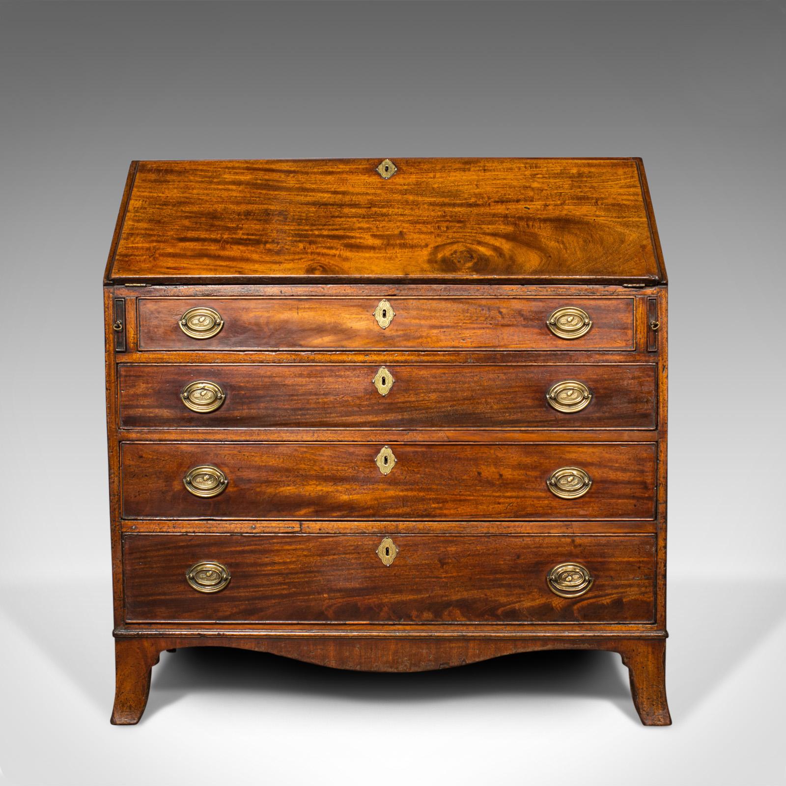 This is an antique bureau. An English, Georgian desk crafted from mahogany in the late 18th century, circa 1790.

Quality craftsmanship in select mahogany with a polished finish
Good consistent color and grain interest throughout
Generous and
