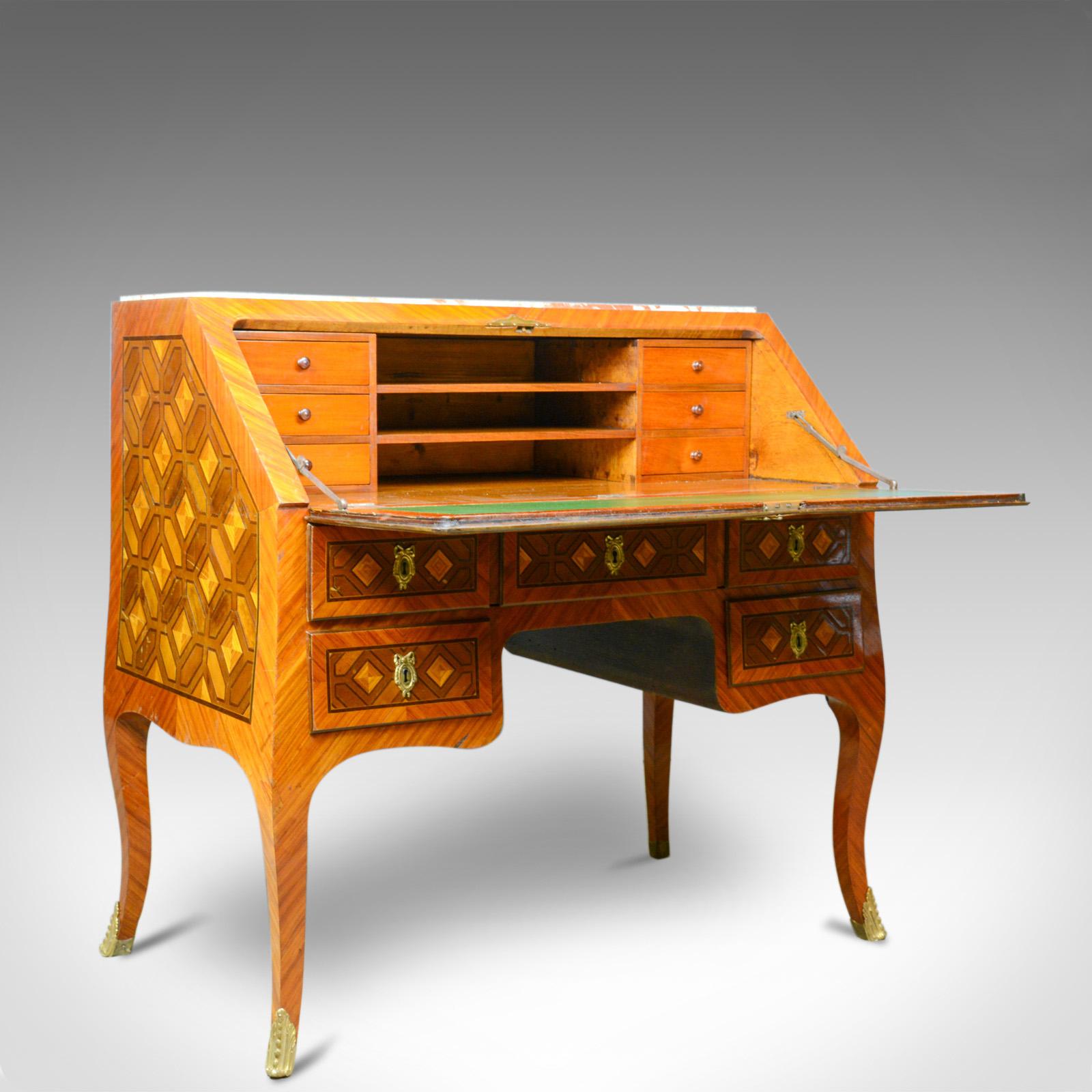This is an antique bureau. A French, marble top, kingwood, marquetry desk dating to the turn of the 20th century, circa 1900.

An interesting and unusual antique bureau
The kingwood displaying good colour and grain
Desirable aged patina with a