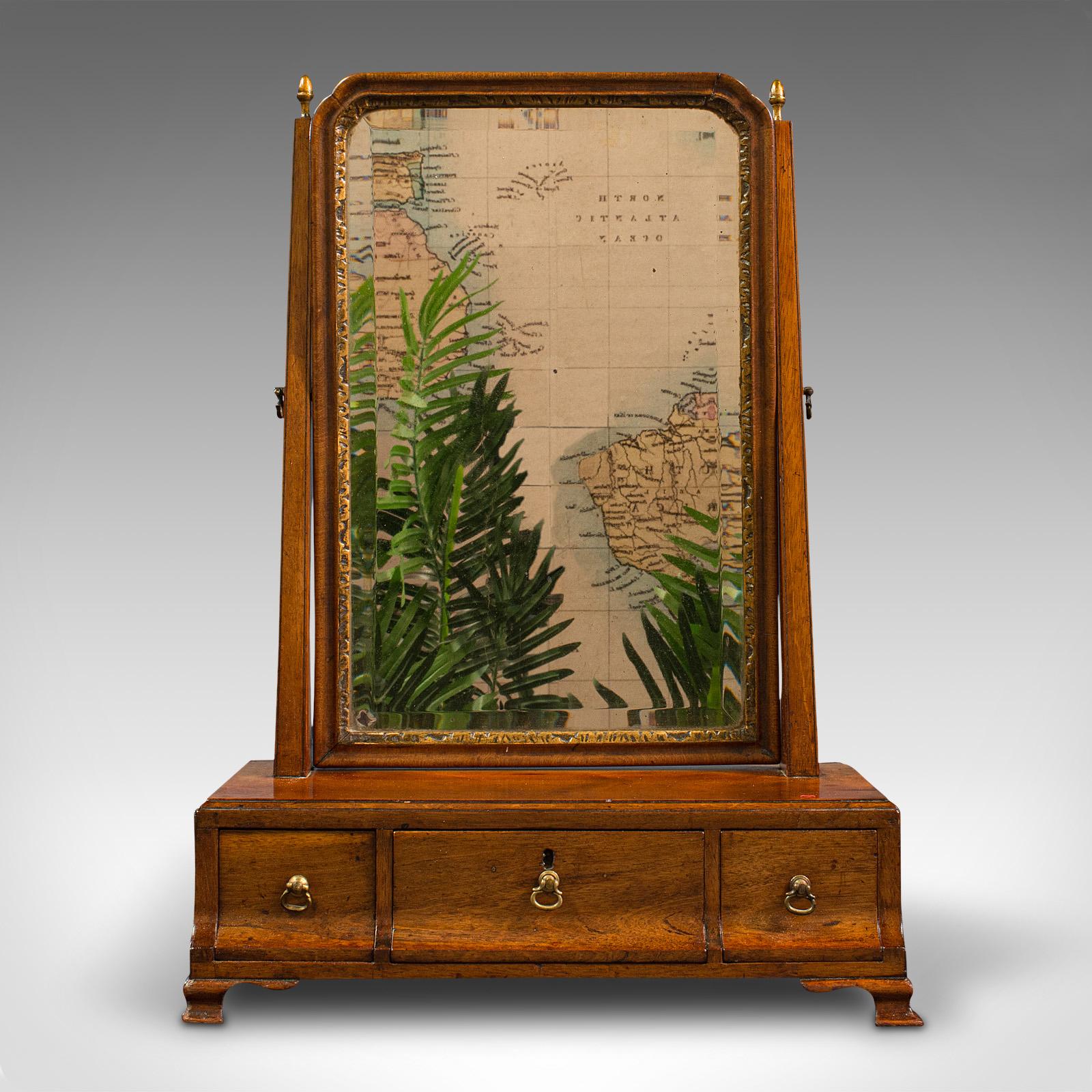 This is an antique bureau mirror. An English, walnut dressing table or swing mirror, dating to the Georgian period, circa 1800.

Delightfully crafted mirror with fine colour and finish
Displays a desirable aged patina and in good order
Select